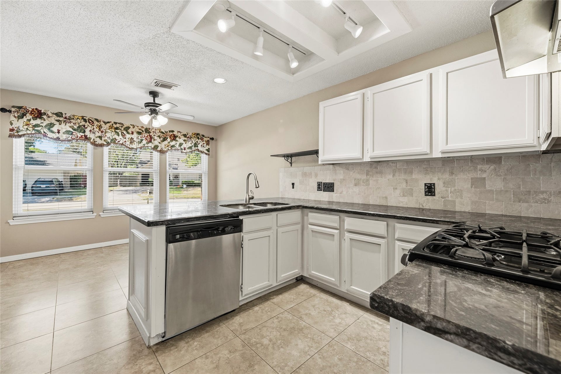 Kitchen into the breakfast area.