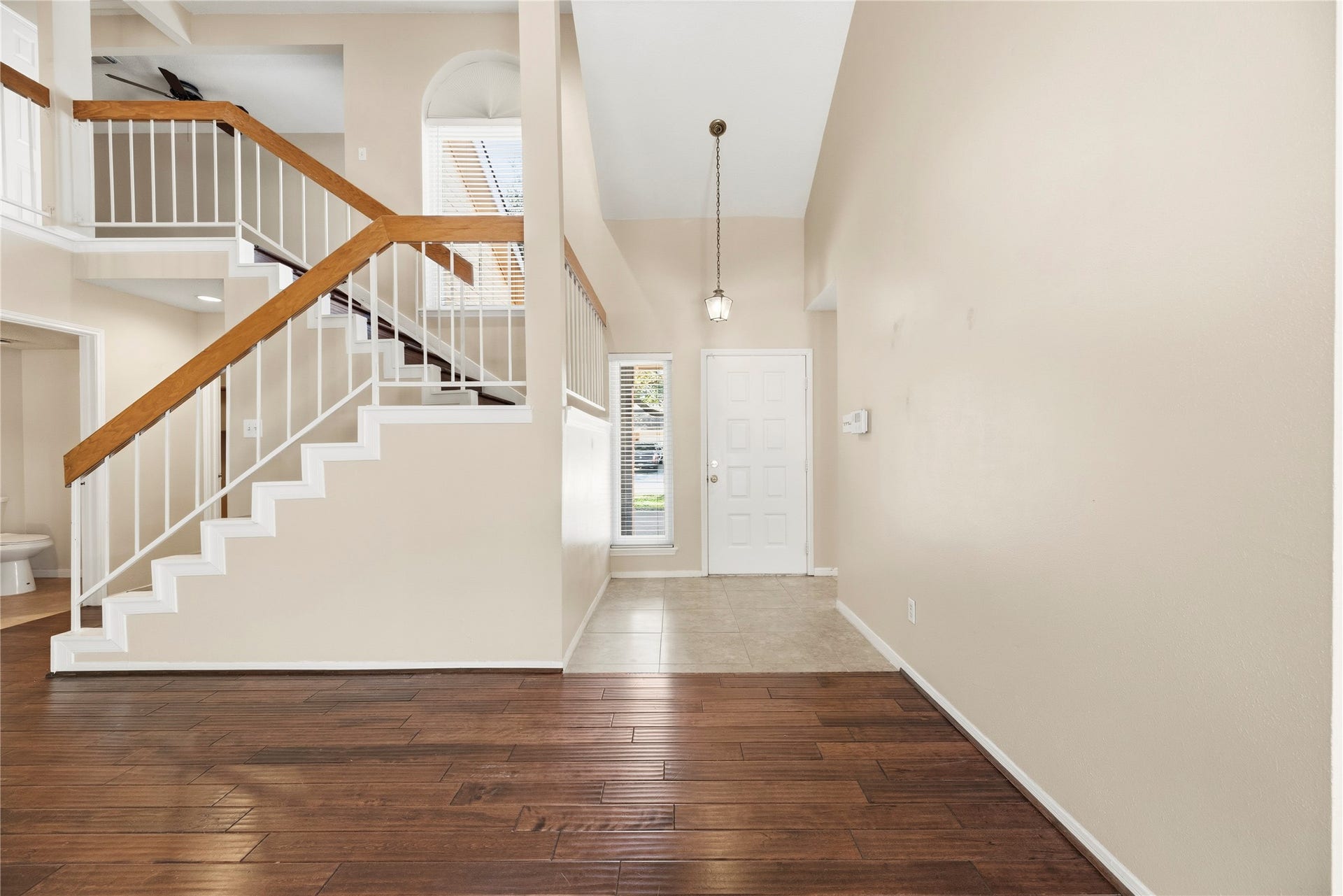 Neutral interior with high ceilings.