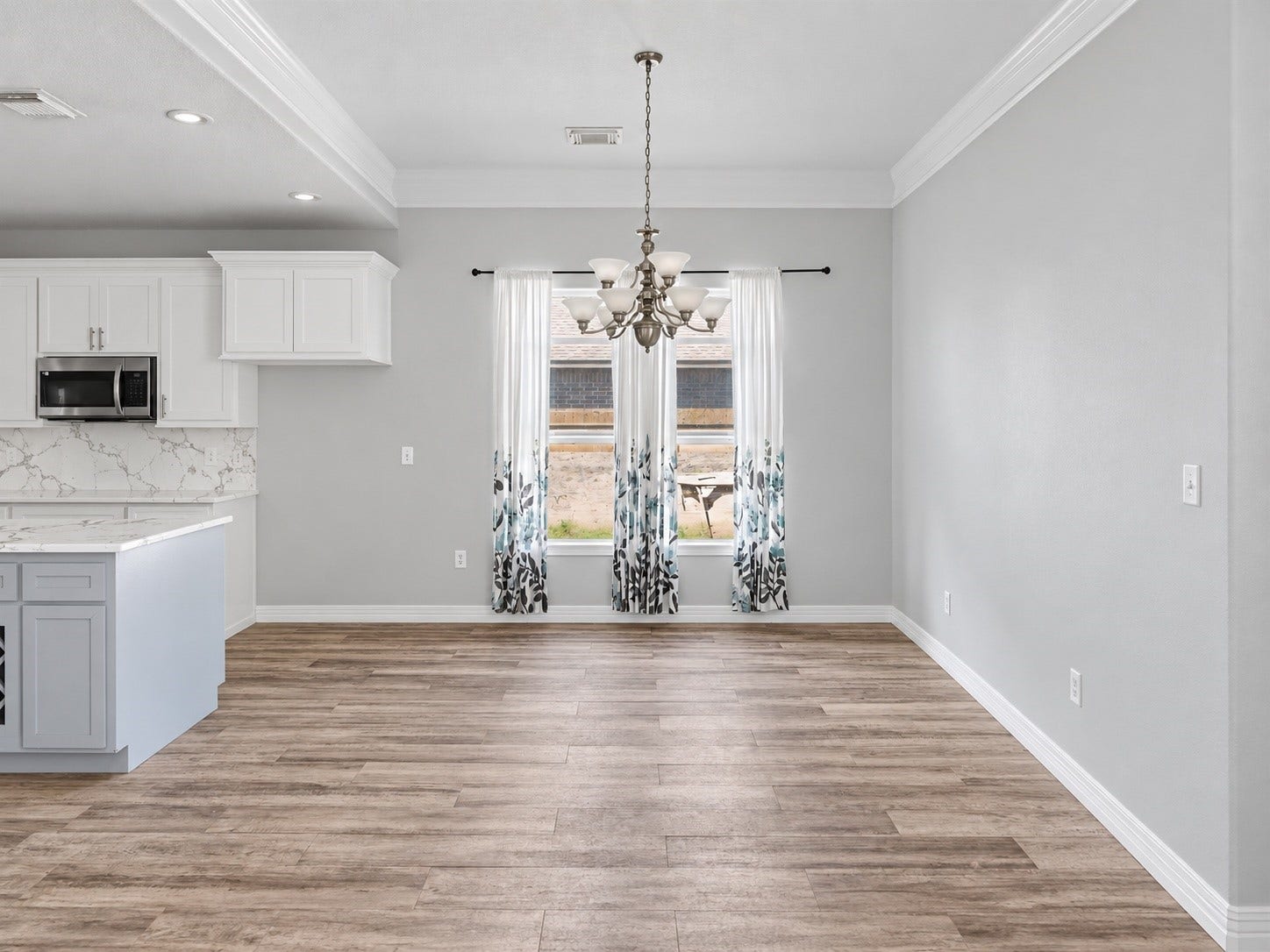 Spacious Dining area conveniently located beside the kitchen, with plenty of room for large dining table and entertaining. ***Digitally enhanced kitchen pictures - backsplash needs to be completed