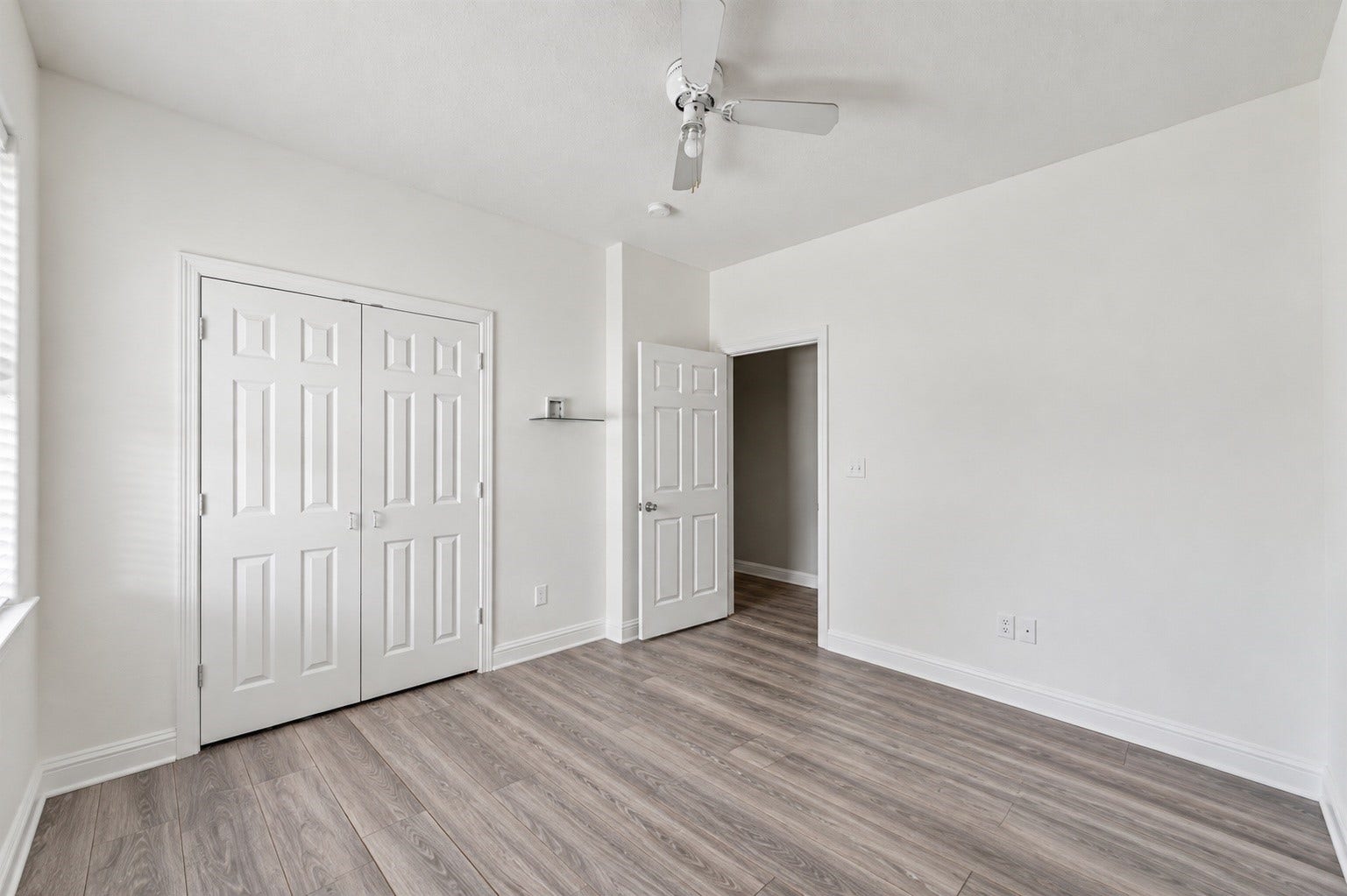 Secondary bedroom with generous closet space and easy access to the adjoiing hallway. ***Digitally enhanced guest BR images - floors need to be finished