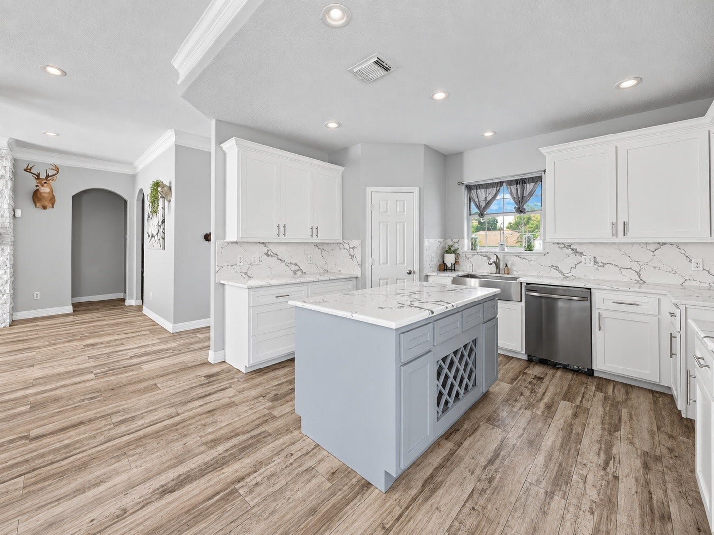 Open-concept kitchen with modern finishes, stainless steel appliances, recessed lighting and easy flow into the adjoining living area.***Digitally enhanced kitchen pictures - backsplash needs to be completed