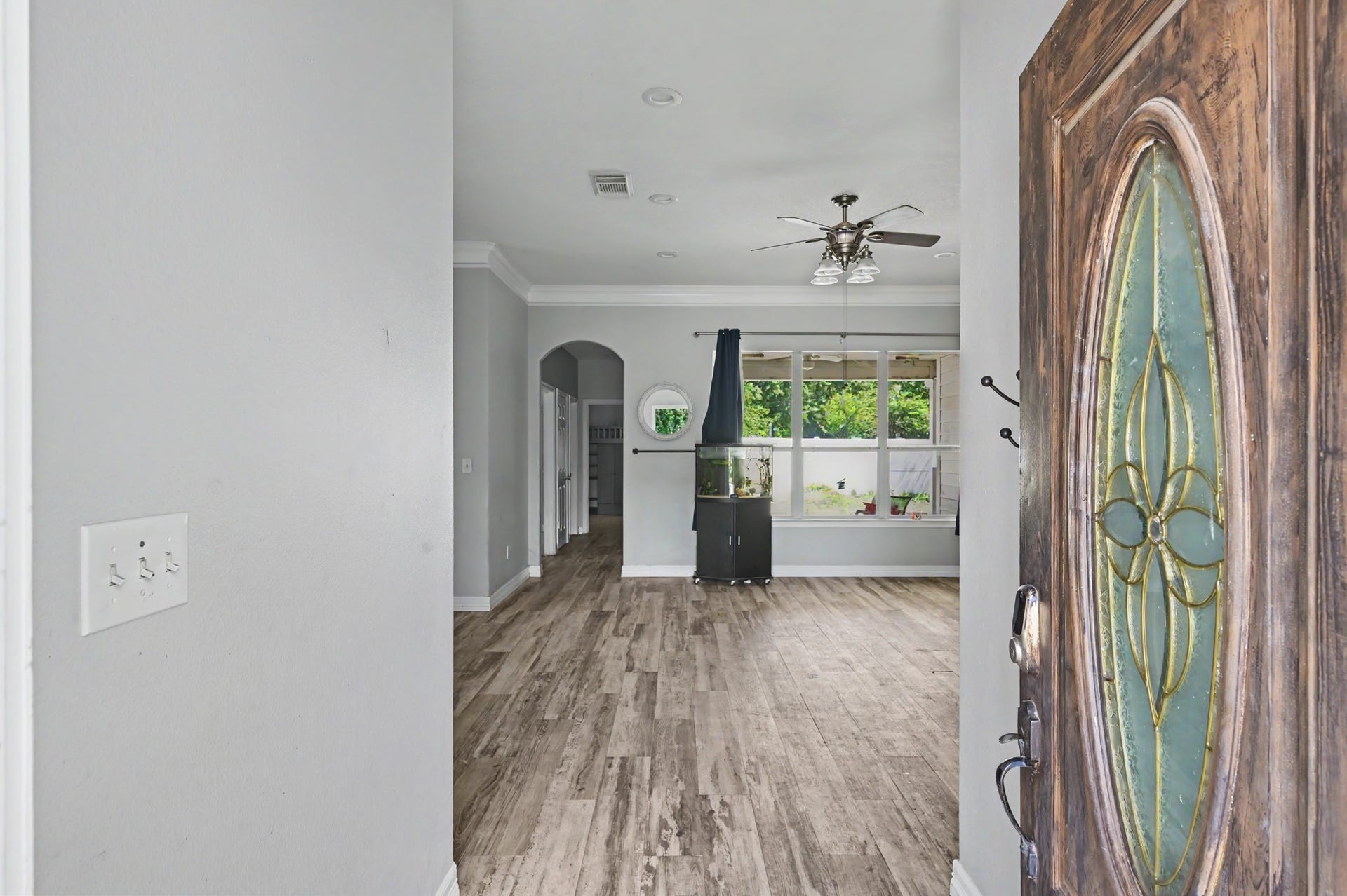 Welcoming entry open directly into spacious, light-filled living area.
