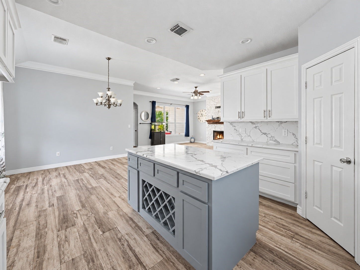 Kitchen opens seamlessly to the dining and living spaces, creating and ideal layout for entertaining and everyday living. ***Digitally enhanced kitchen pictures - backsplash needs to be completed