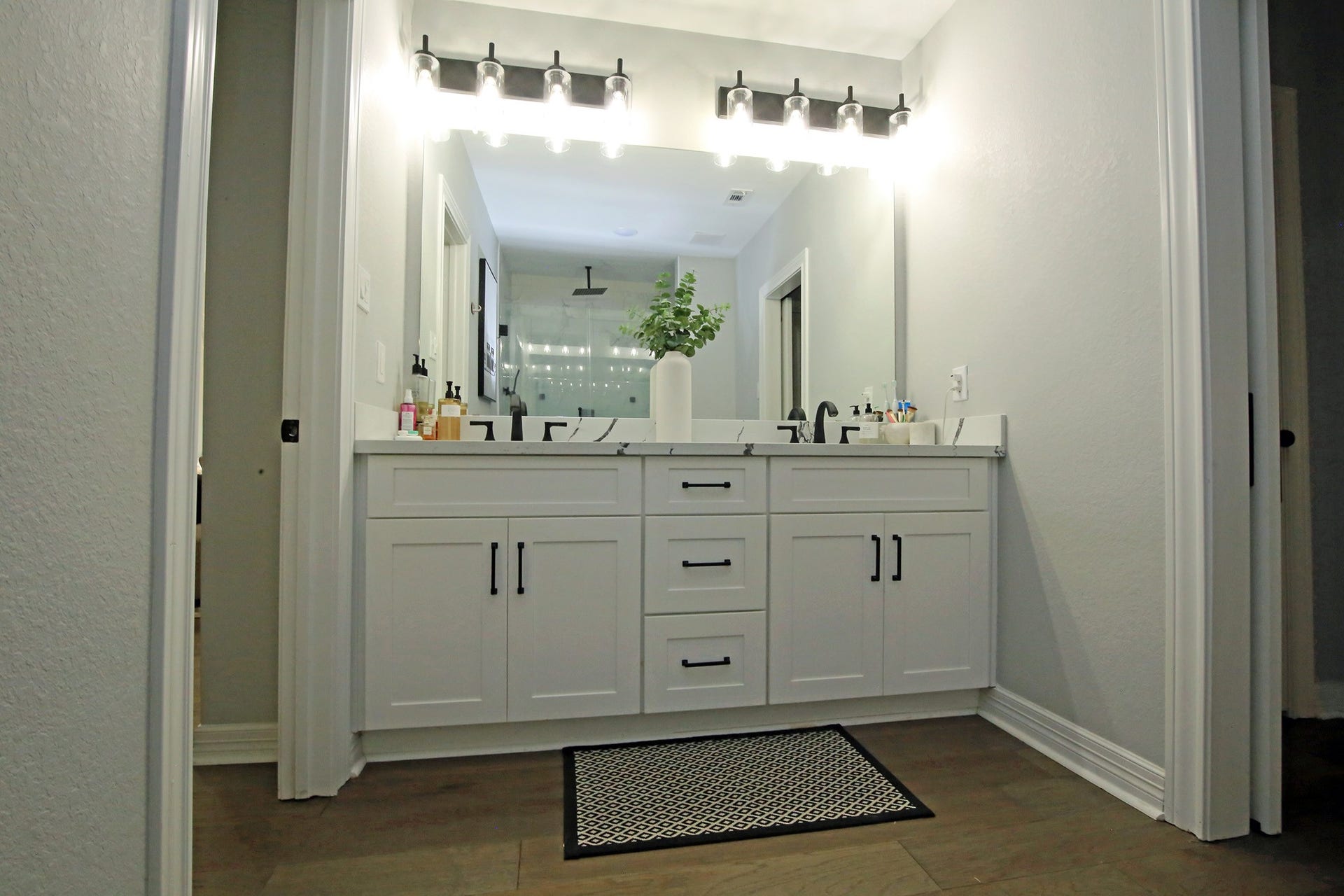 7101 2nd Street, Hitchcock, TX 77563 Plenty of lighting in the mirror with double sinks and storage!