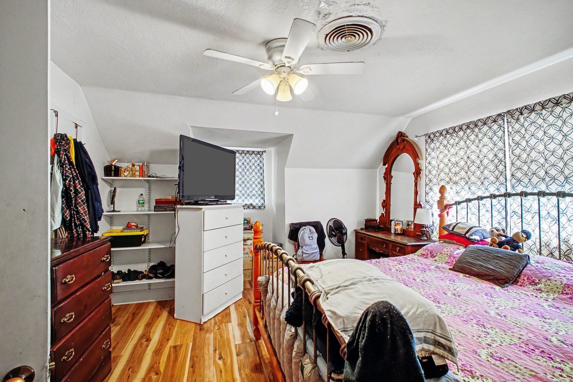 Generously sized multi-purpose bedroom or sitting area with ample floor space.