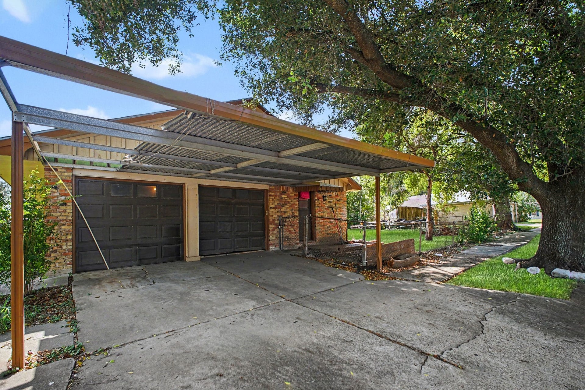 Covered backyard patio / carport structure offering outdoor shade and relaxation space.