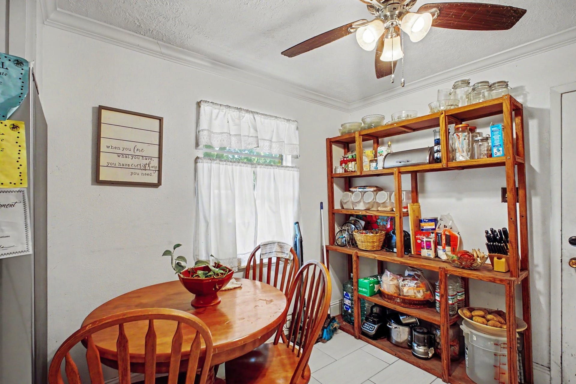 Cozy informal dining or breakfast nook setup featuring a round table and warm lighting.