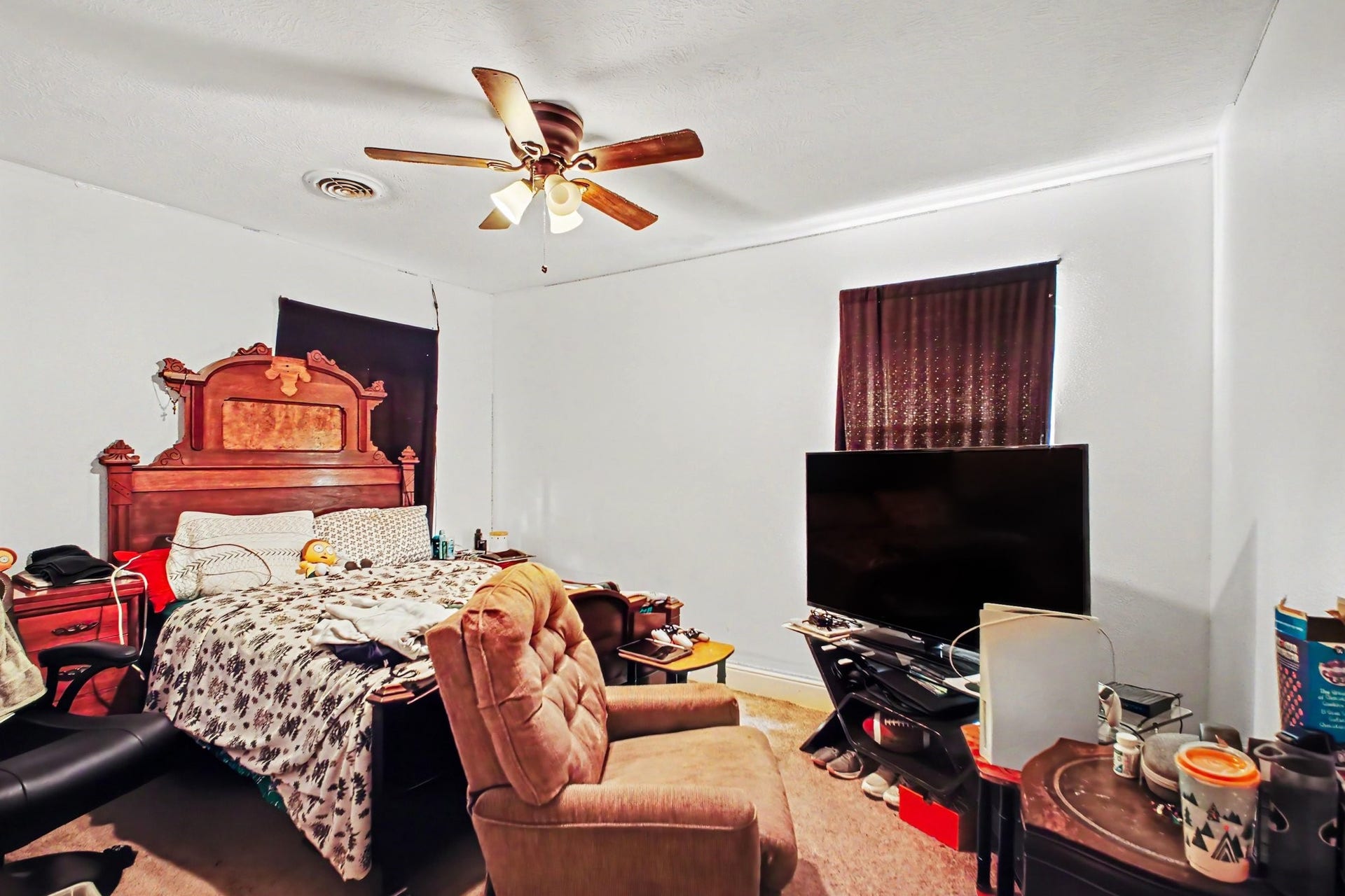 Alternate perspective of the spacious bedroom showing comfortable layout arrangements.