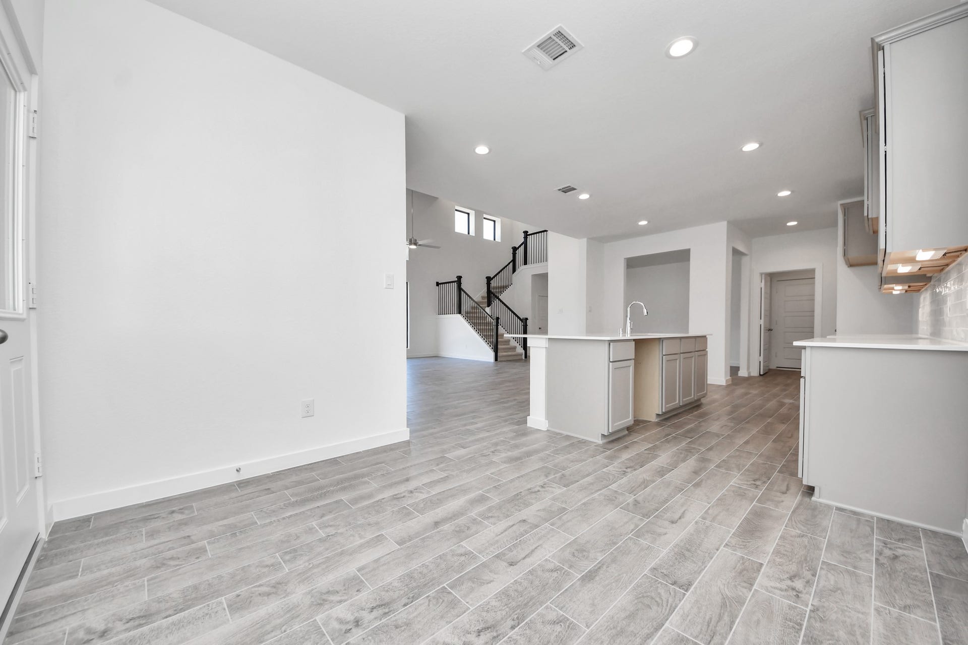 Enjoy breakfast with ease in the connected and cozy breakfast area, seamlessly integrated with the kitchen for utmost convenience. Step through the back door for a breath of fresh air onto the covered patio, extending your living space to the outdoors