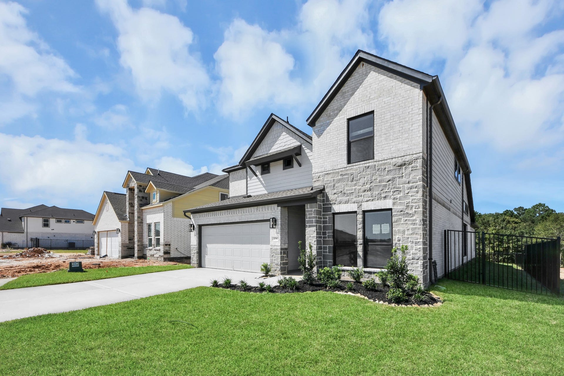 Home features a convenient 2-car garage complemented by a spacious driveway, offering ample parking for you and your guests.