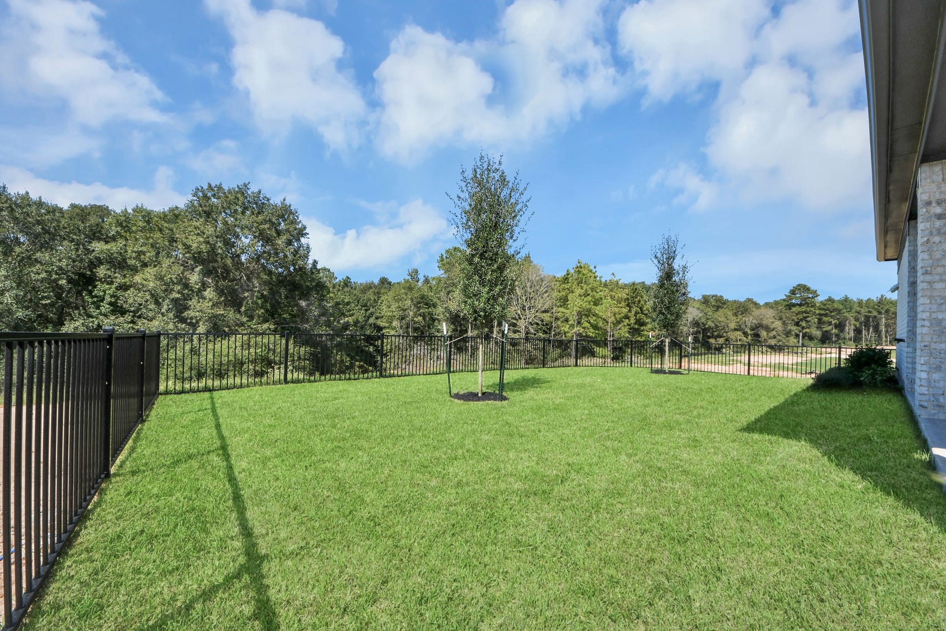 Come and see this spacious backyard with its beautiful covered patio. There is plenty of room for the kids to play and adults to relax. Perfect for your outdoor living space, patio furniture, bbq pit, and so much more. The possibilities are endless!
Experience outdoor living at its finest on this expansive covered patio, thoughtfully designed for BBQs and delightful outdoor dining.