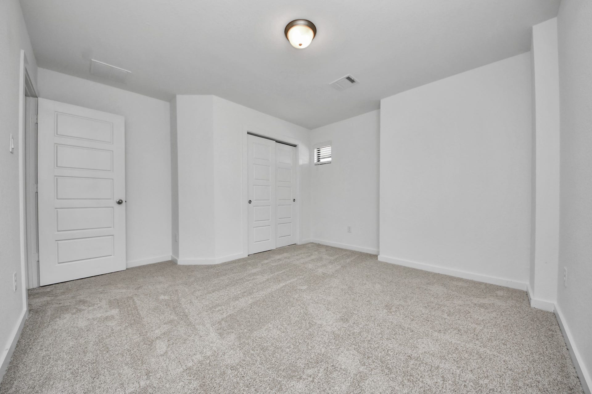 Generously sized secondary bedrooms featuring spacious closets, soft and inviting carpeting underfoot, large windows allowing plenty of natural light, and the added touch of privacy blinds for your personal retreat.