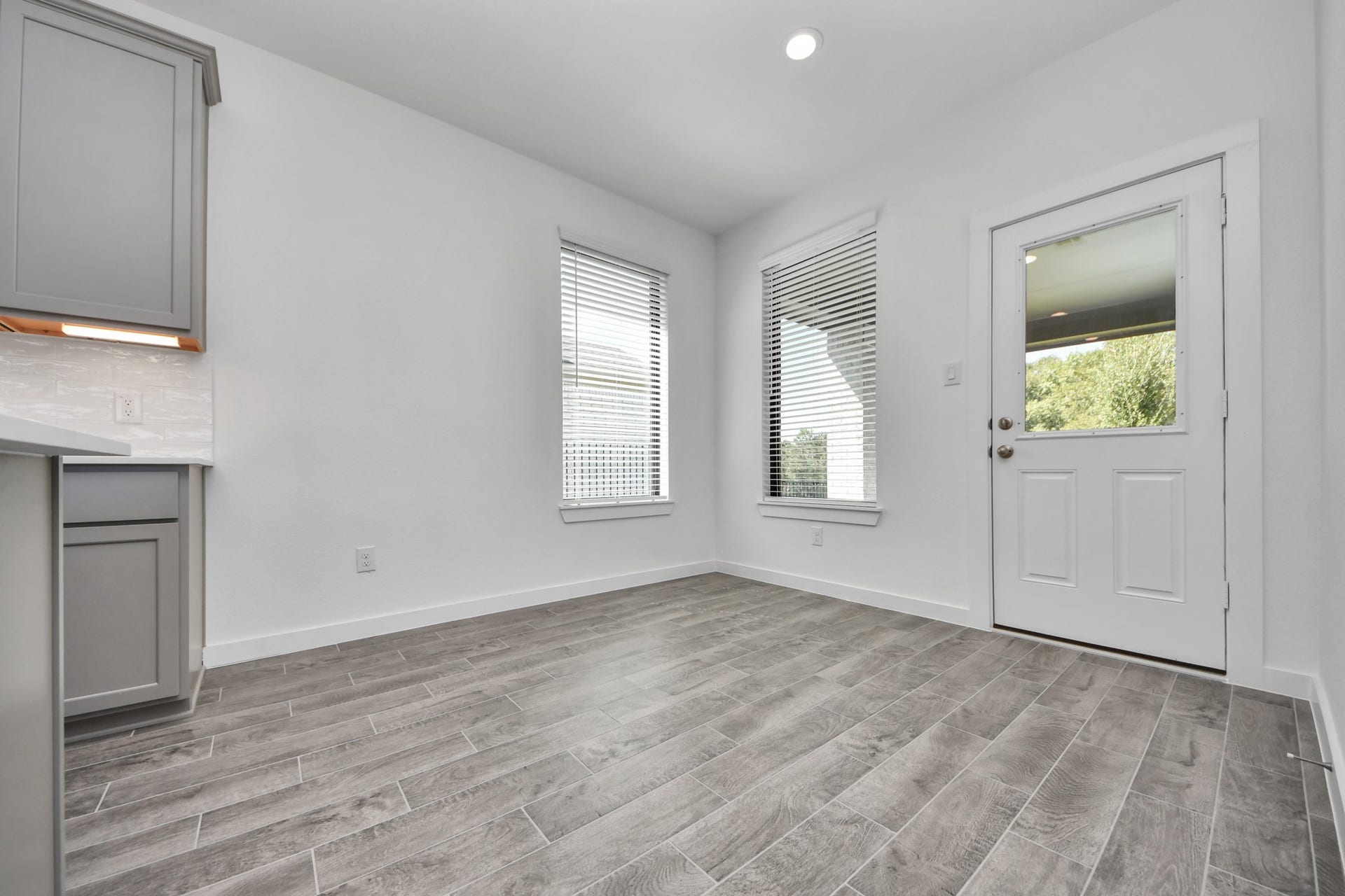 Enjoy breakfast with ease in the connected and cozy breakfast area, seamlessly integrated with the kitchen for utmost convenience. Step through the back door for a breath of fresh air onto the covered patio, extending your living space to the outdoors