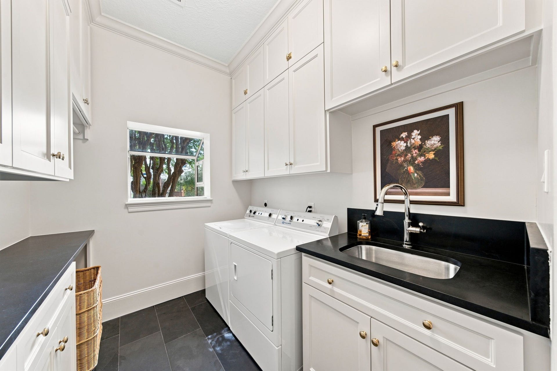 23 S Brokenfern Drive Drive, The Woodlands, TX 77380 Laundry room boasts onsite built custom cabinetry, soapstone counters, slate floor and elegant brass hardware