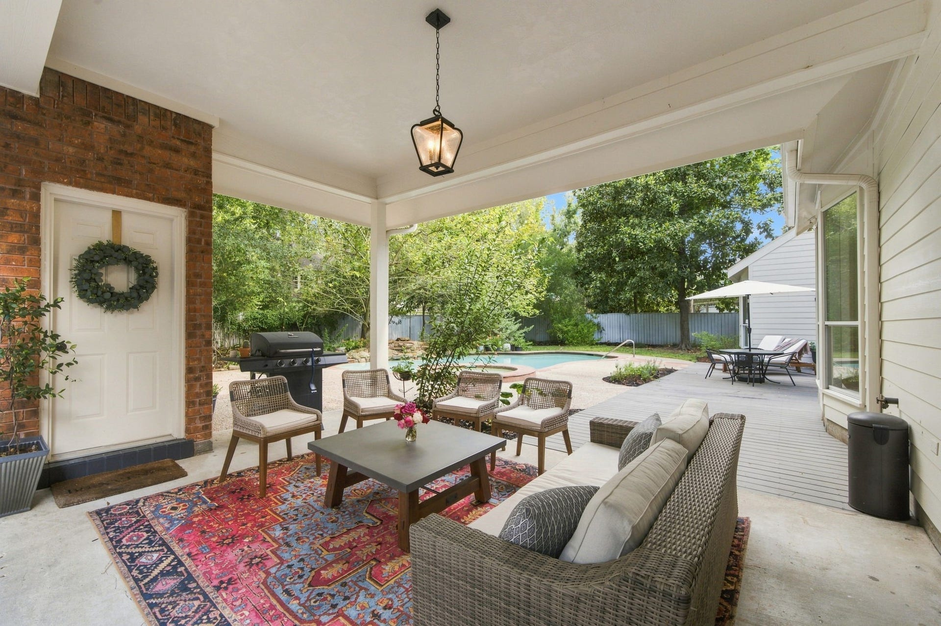 23 S Brokenfern Drive Drive, The Woodlands, TX 77380 Covered outdoor patio featuring direct access to a full bathroom
