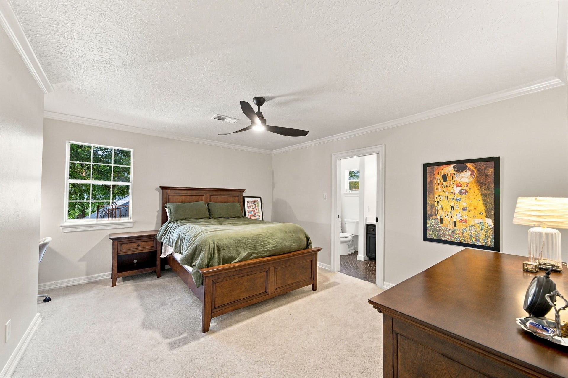 23 S Brokenfern Drive Drive, The Woodlands, TX 77380 Third upstairs bedroom featuring a built-in desk and a private full bathroom