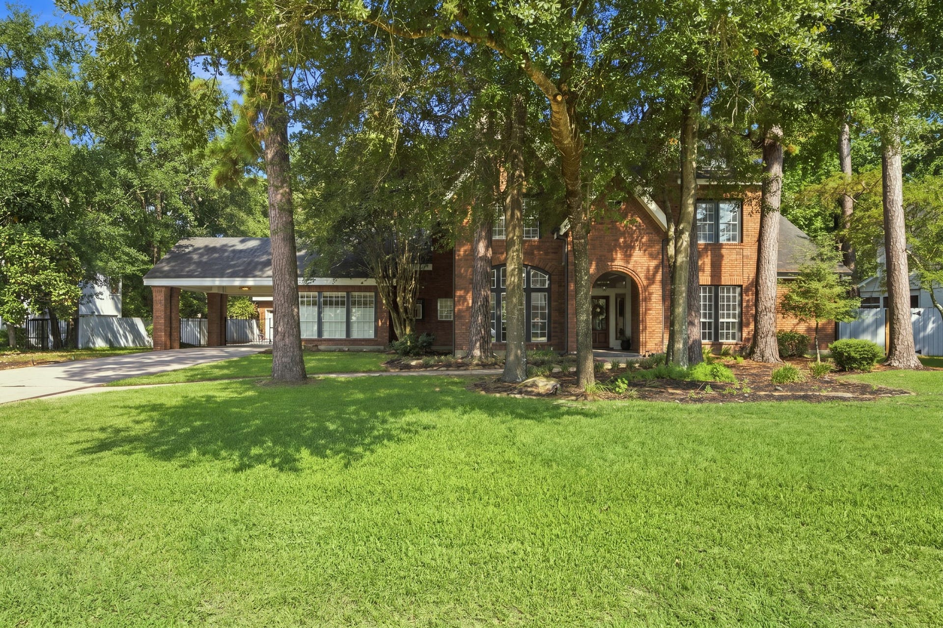 23 S Brokenfern Drive Drive, The Woodlands, TX 77380 Mature trees surrounding the property provide abundant shade and enhanced curb appeal