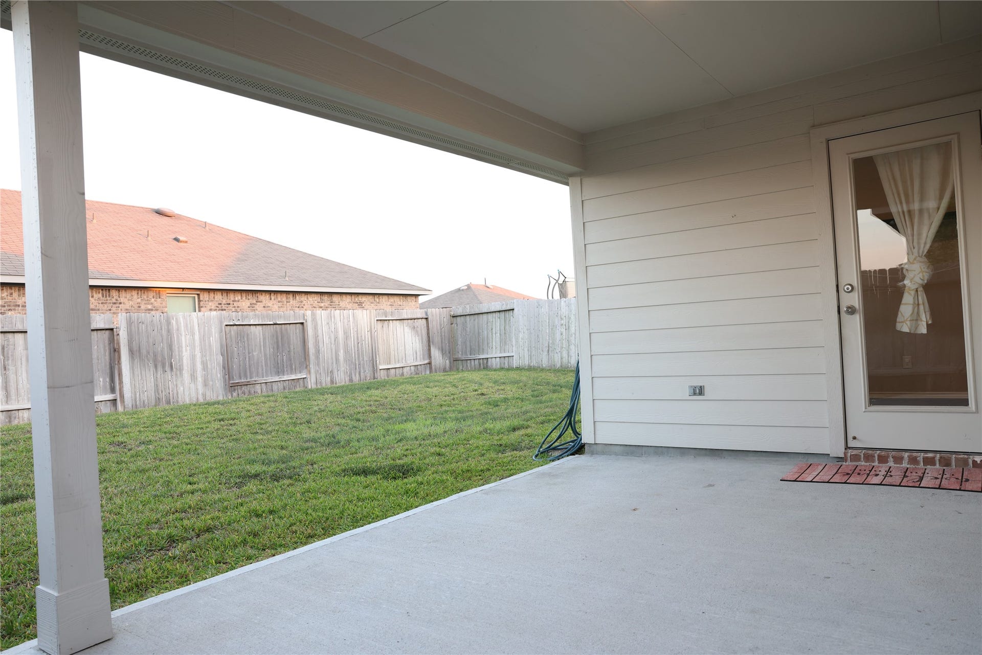 Enjoy outdoor living with a spacious covered back patio, perfect for relaxing or entertaining in any weather.