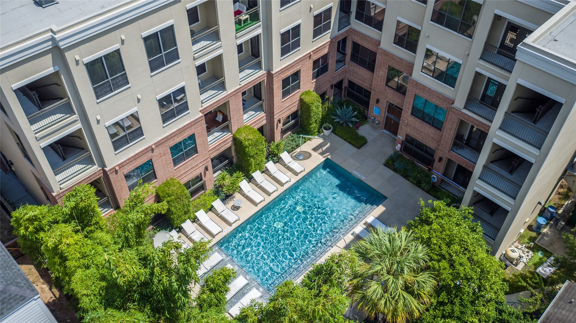 This is one of 2 pools in this boutique property spread out over 5 buildings. This infinity pool with a tanning ledge is in Building 4