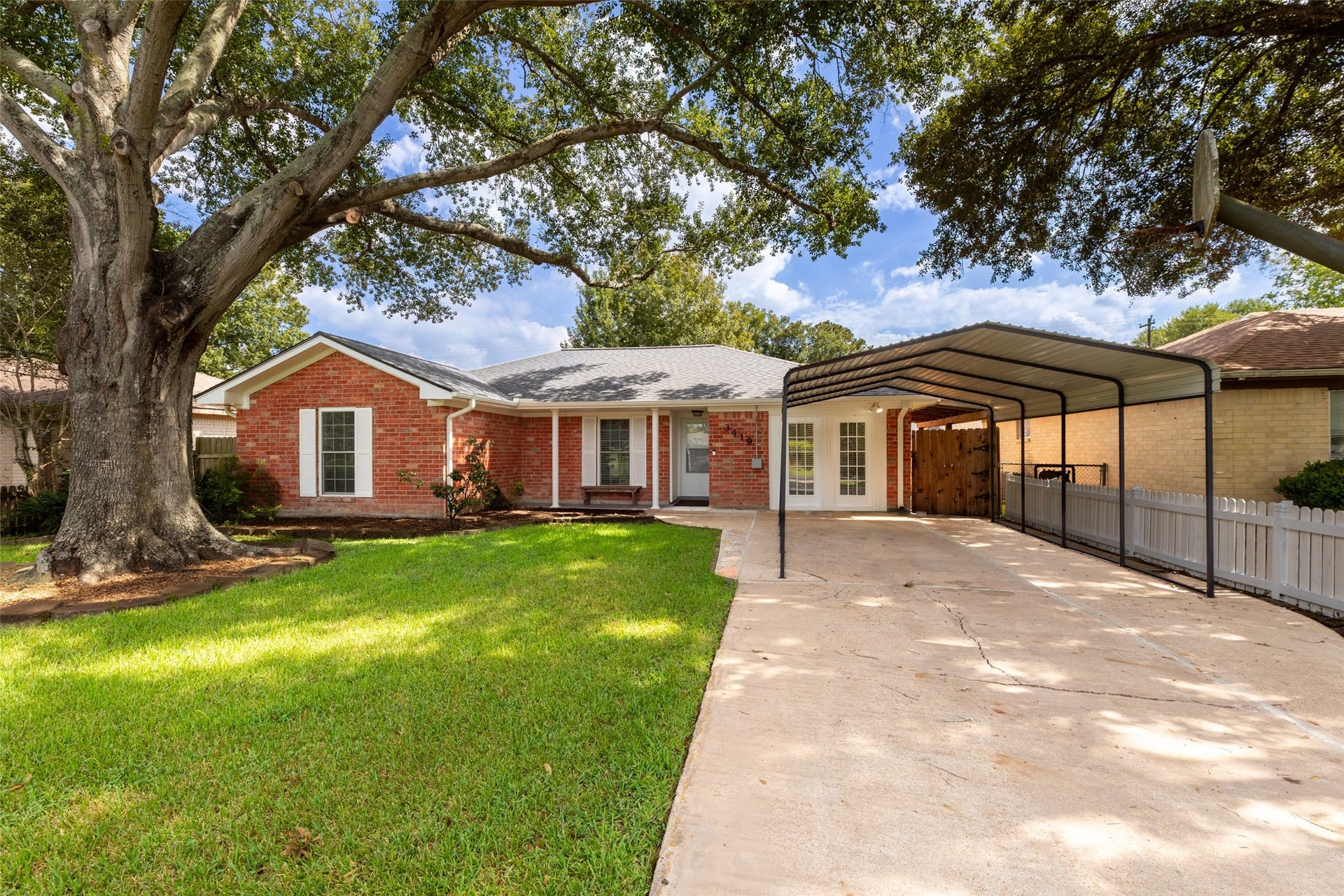 3419 Beasley Avenue, Needville, TX 77461 Beautiful brick home with detached carport