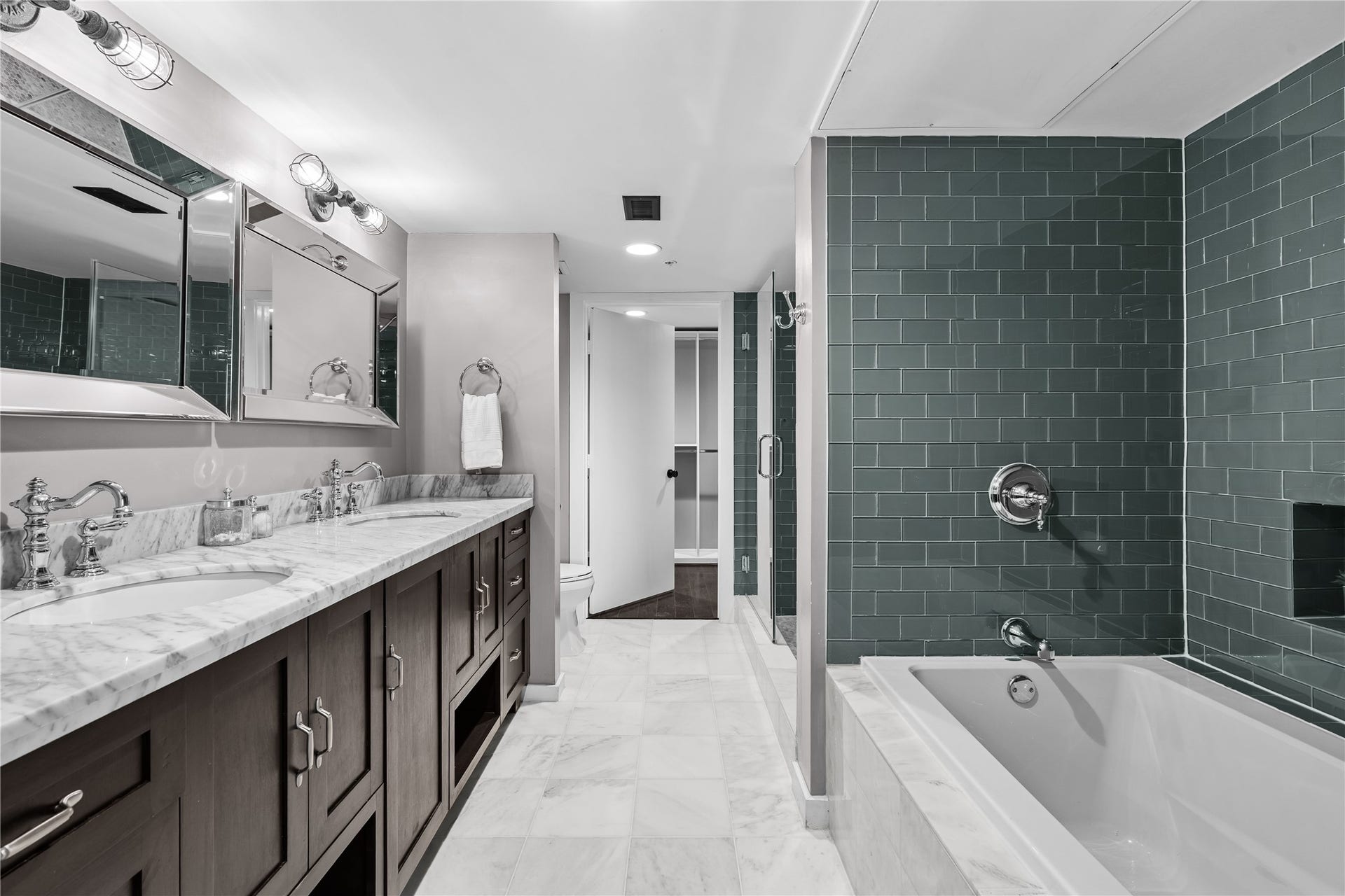 2000 Bagby St Street, #13430, Houston, TX 77002 The remodeled primary bath continues with an oversized glass enclosed shower, designer tile and a separate soaking tub, creating a clean, contemporary retreat.