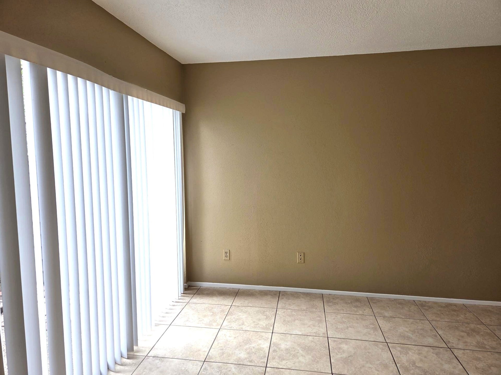 Primary Bedroom w/Sliding Doors to private Patio.