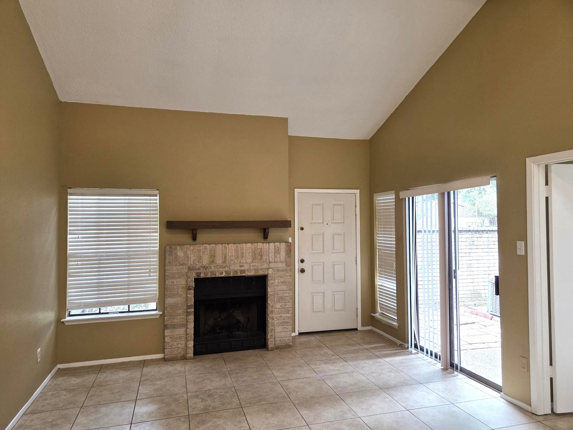 Sliding doors open up to private patio.