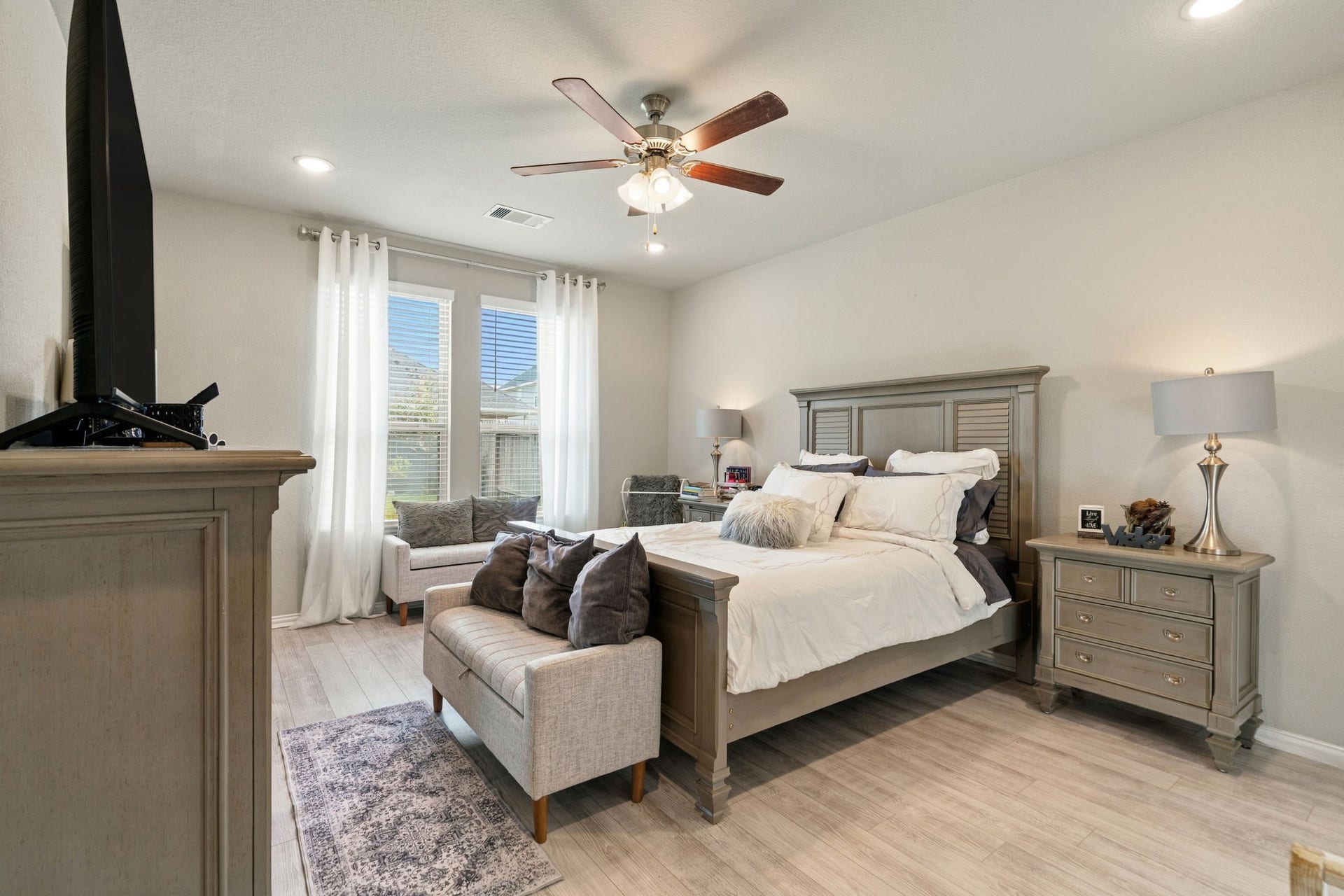 31410 Whitfield Court, Fulshear, TX 77441 Spacious and bright Master bedroom featuring a cozy sitting area.