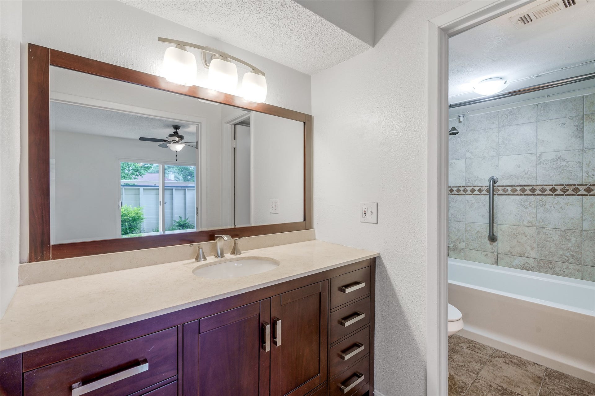 250 El Dorado Boulevard, #283, Houston, TX 77598 This stylish bathroom offers a practical layout with a separate shower/tub combo and toilet area, plus a spacious sink vanity perfect for both convenience and elegance.