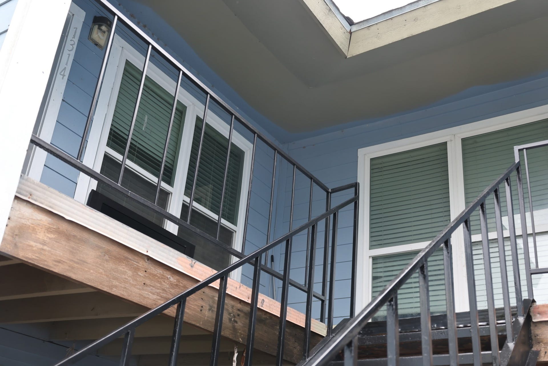 5625 Antoine Drive, #1314, Houston, TX 77091 Exterior view of the stairs and covered walkway leading to Unit 1314.