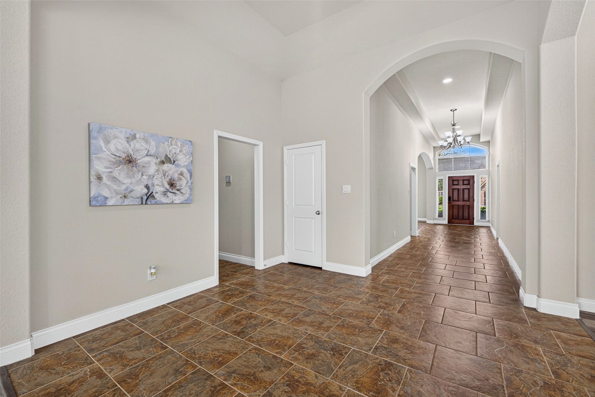 4003 Birch Vale Lane, Sugar Land, TX 77479 Foyer featuring soaring ceilings, beautiful tile flooring, and neutral, modern paint tones.
