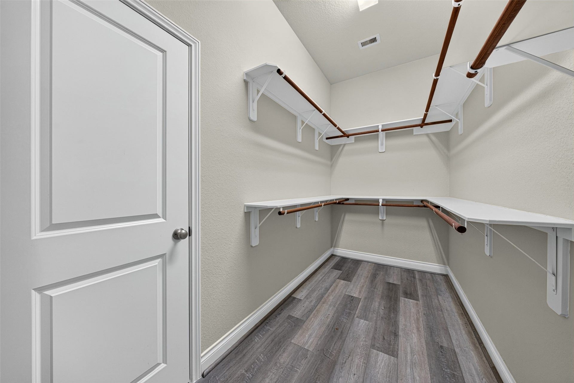 4003 Birch Vale Lane, Sugar Land, TX 77479 Expansive walk-in closet in the primary suite with custom shelving to keep family wardrobes organized.