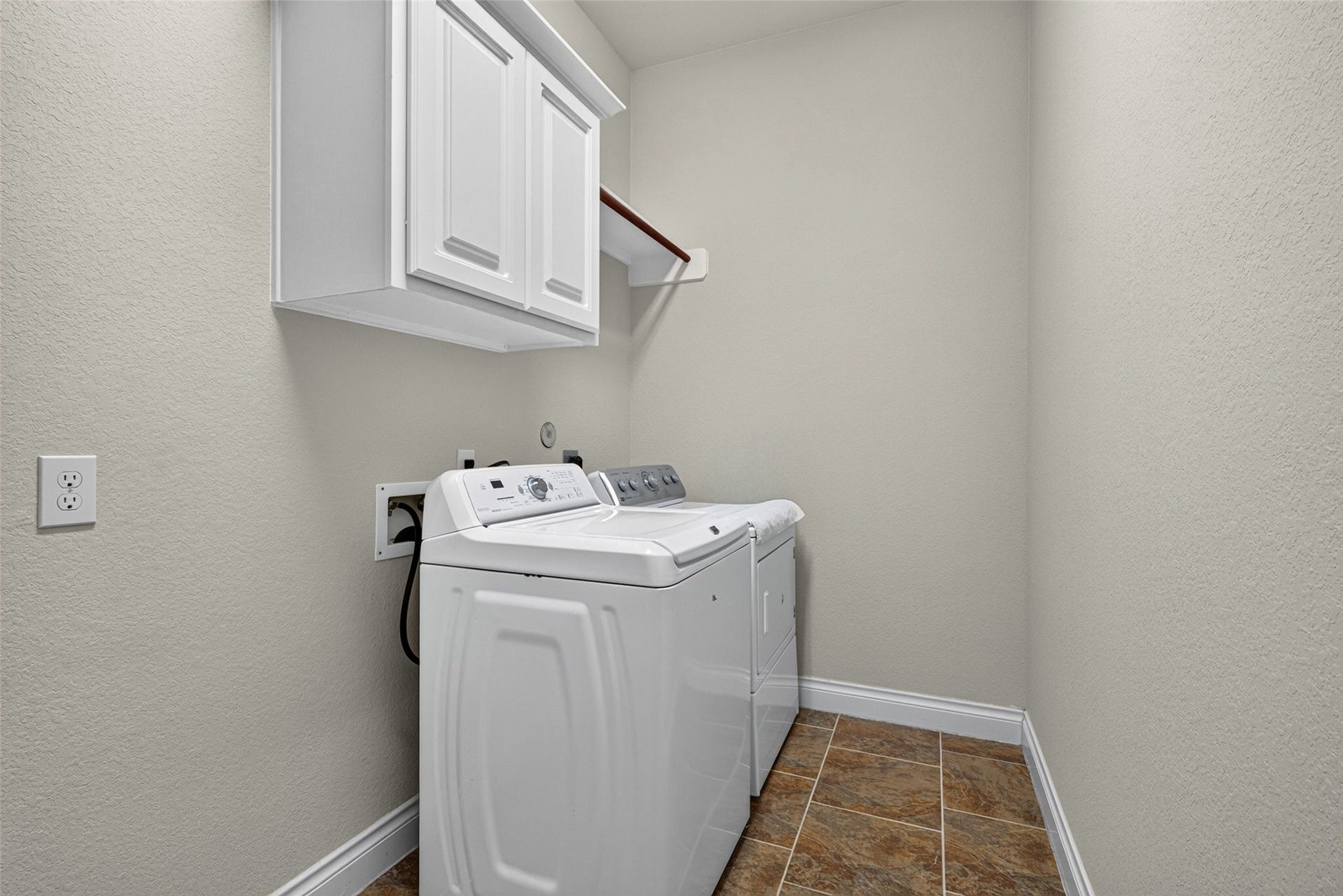 4003 Birch Vale Lane, Sugar Land, TX 77479 Functional laundry room with built-in storage to keep household chores easy and organized.