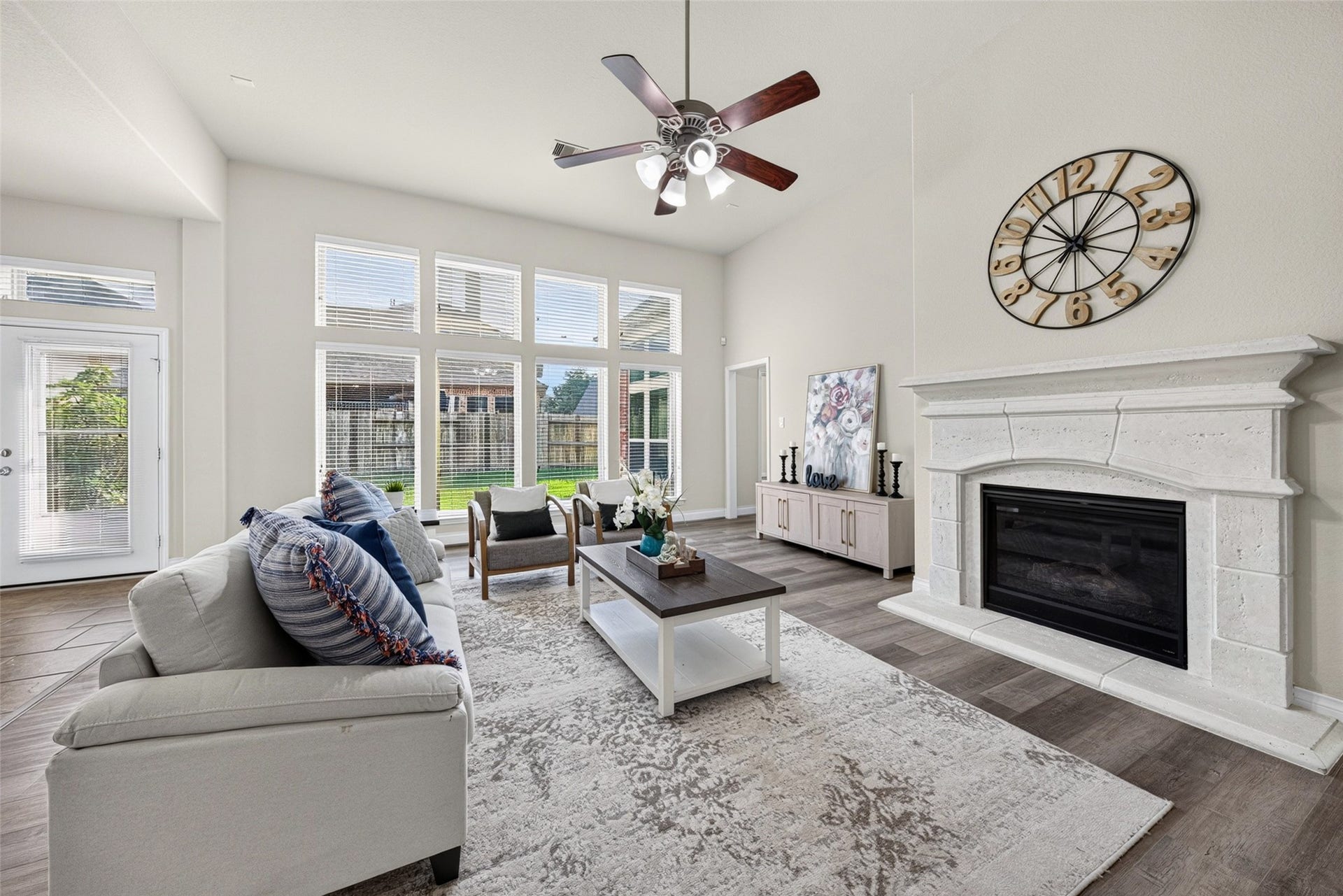 4003 Birch Vale Lane, Sugar Land, TX 77479 Cozy living room centered around a charming fireplace, perfect for warm family movie nights and chilly evenings.