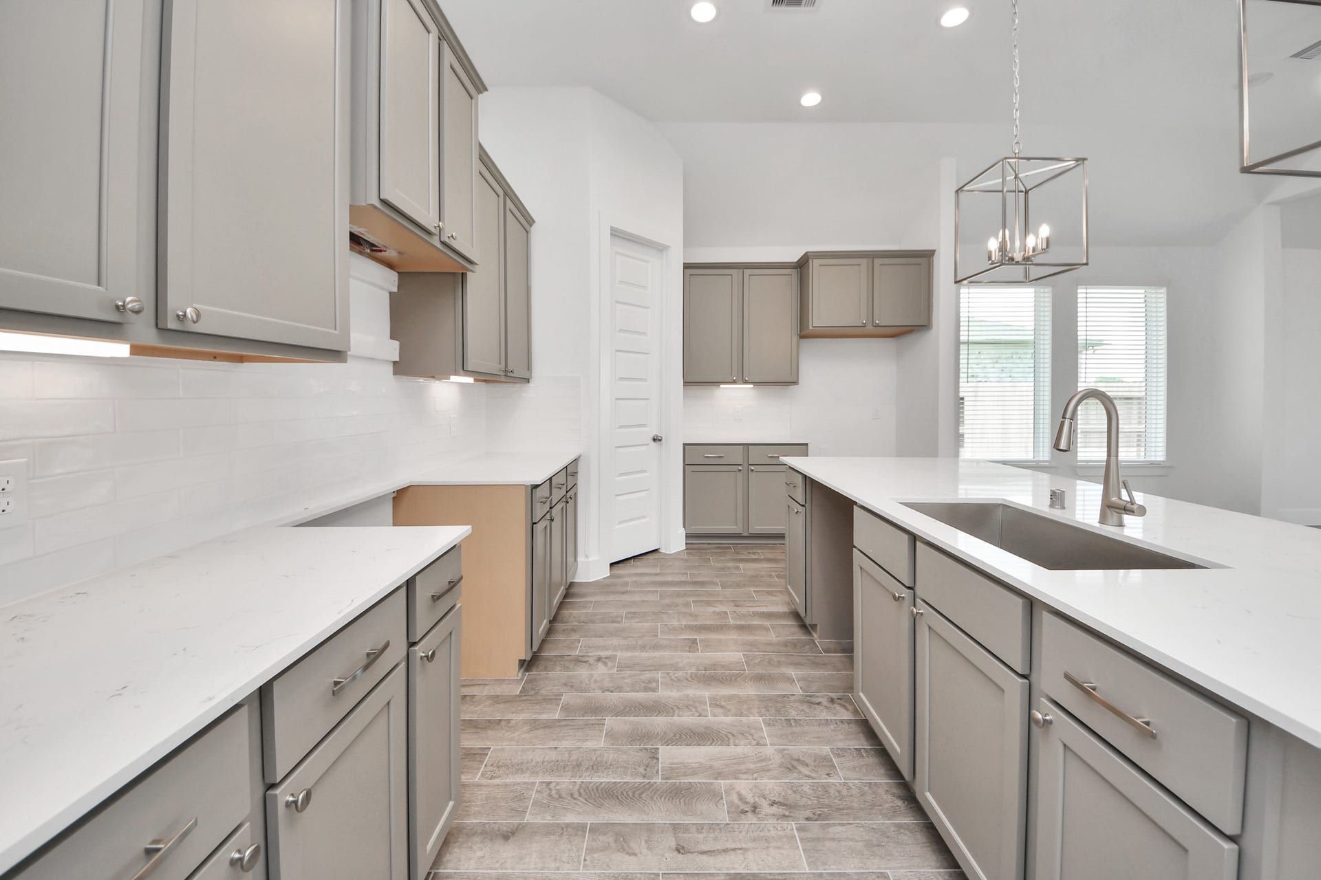 3201 Skerne Spring Drive, Spring, TX 77373 The kitchen is a culinary haven, featuring granite countertops, a tile backsplash, stainless steel appliances, 42 upper cabinets, and undercabinet lighting. Sample photo of completed home with similar floor plan. Actual colors and selections may vary.