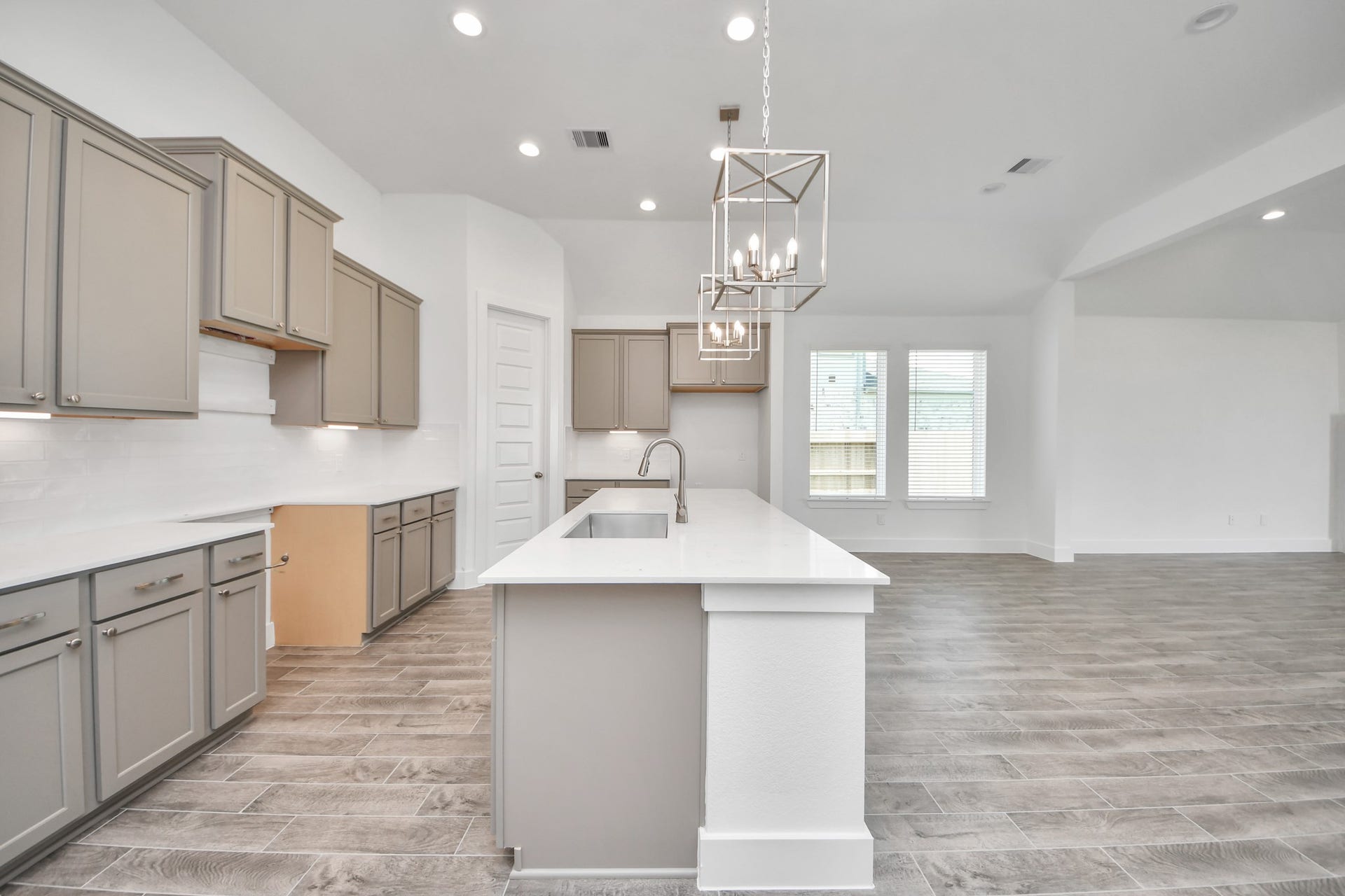 3201 Skerne Spring Drive, Spring, TX 77373 The extended counter area adds both practicality and style, making meal preparation a breeze. Every detail is thoughtfully designed to enhance the kitchen's functionality and aesthetic appeal. Sample photo of completed home with similar floor plan. Actual colors and selections may vary.
