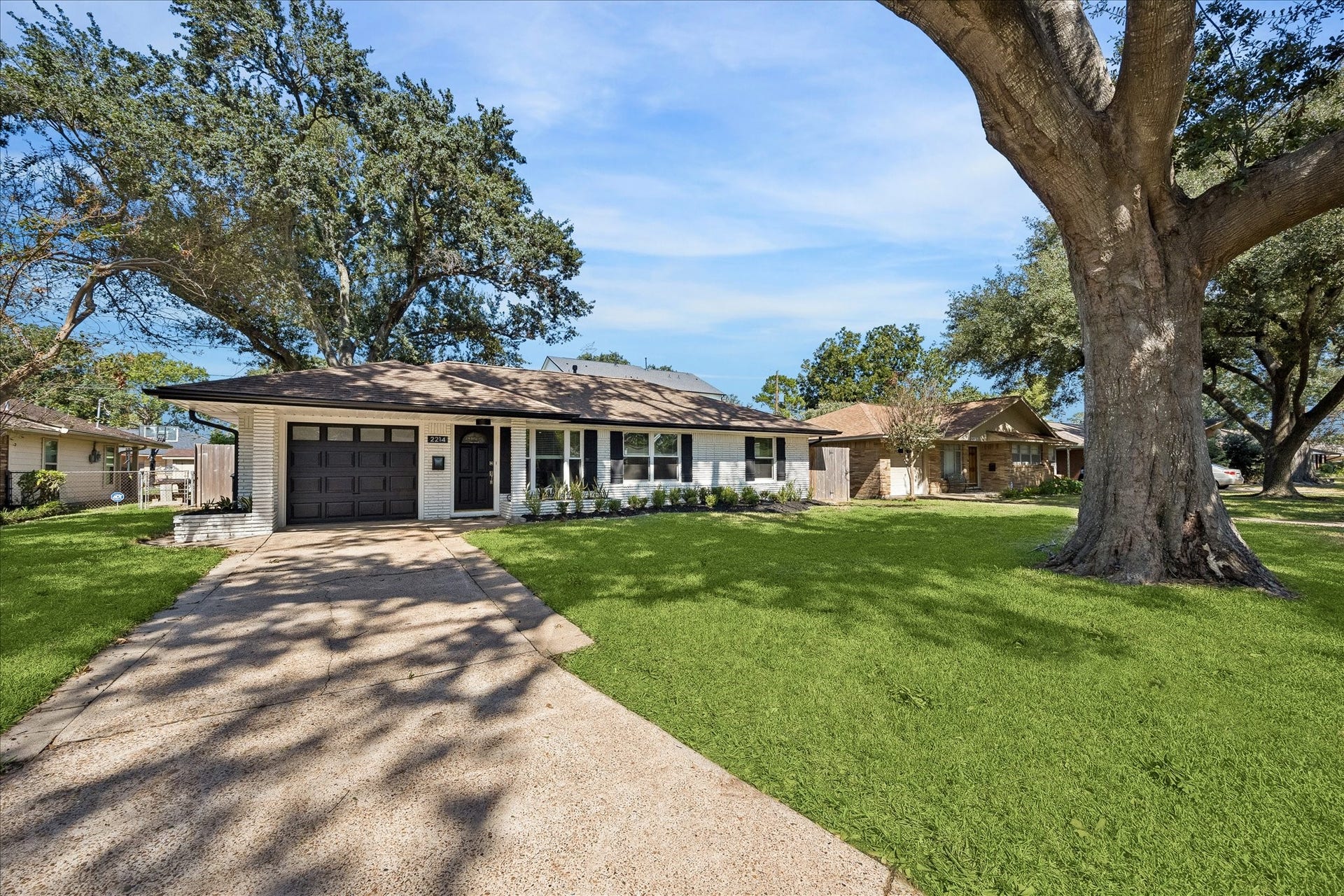 2214 Bron Holly Drive, Houston, TX 77018 Mature trees, a welcoming front lawn, and classic Shepherd Forest character complete the picture.