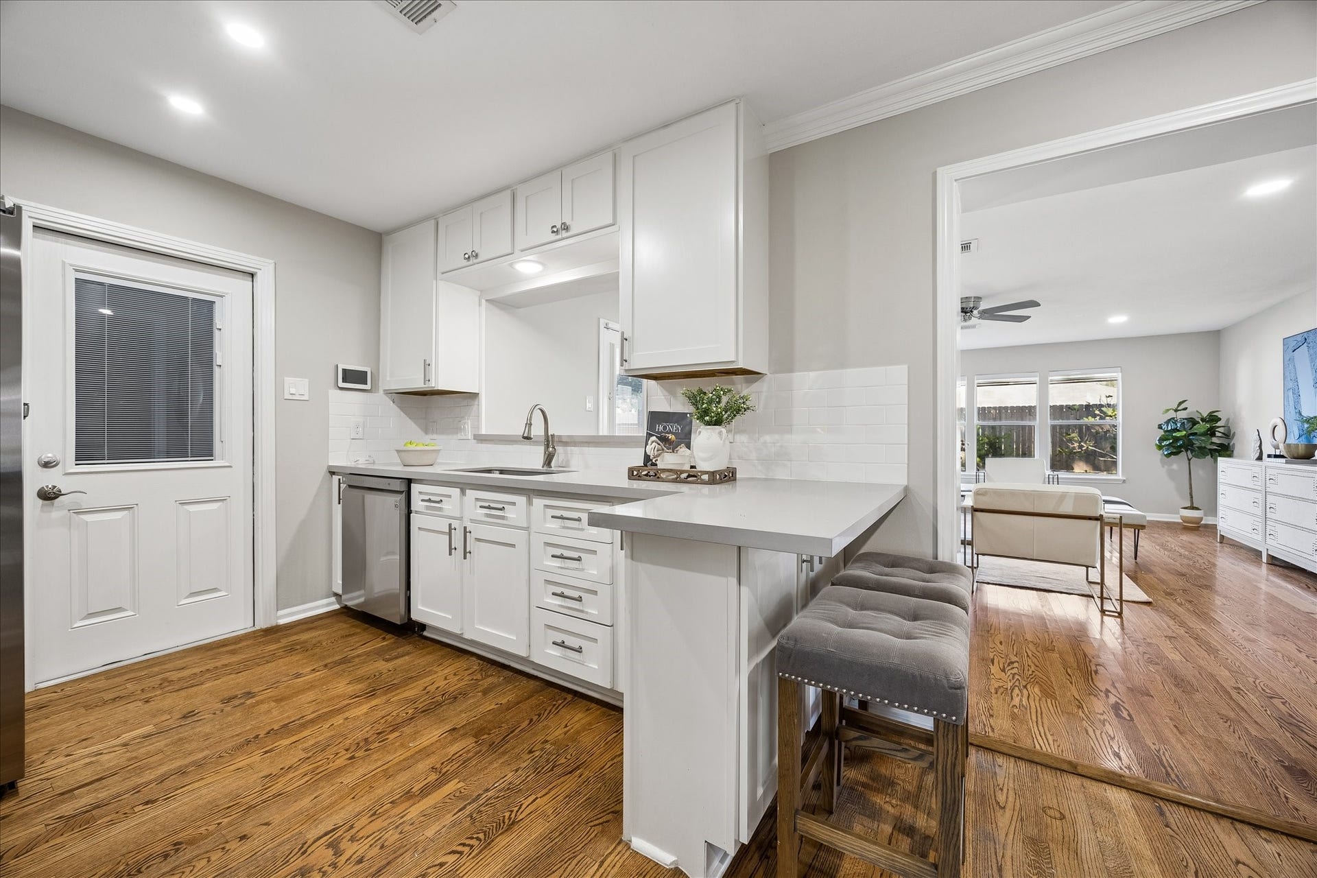 2214 Bron Holly Drive, Houston, TX 77018 A thoughtfully designed kitchen with generous cabinetry, breakfast seating, and stylish details.