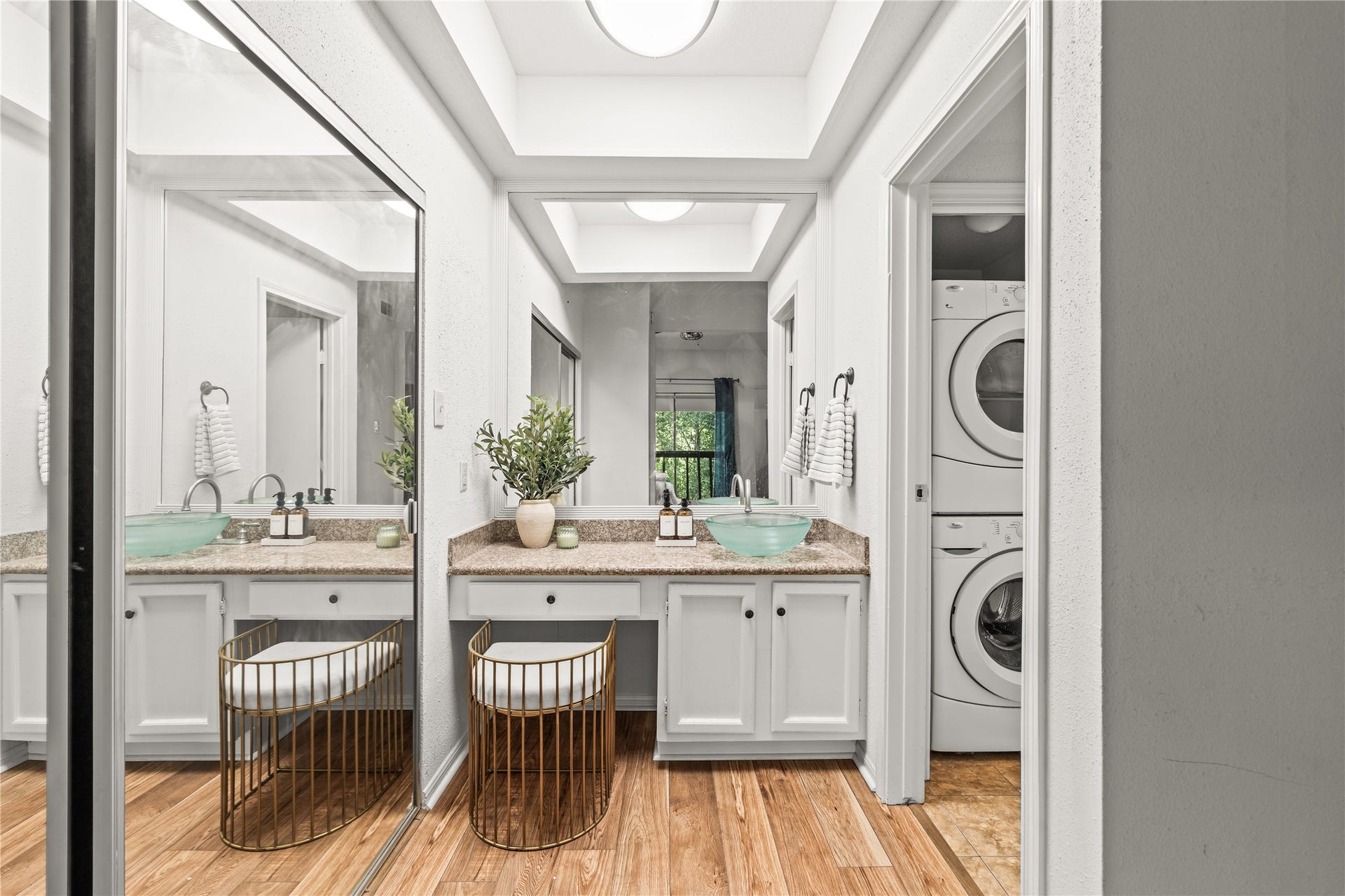 11711 Memorial Drive, #593, Houston, TX 77024 A dedicated vanity creates a convenient space to get ready each morning, while the full-size, in-unit washer and dryer make everyday living that much easier.