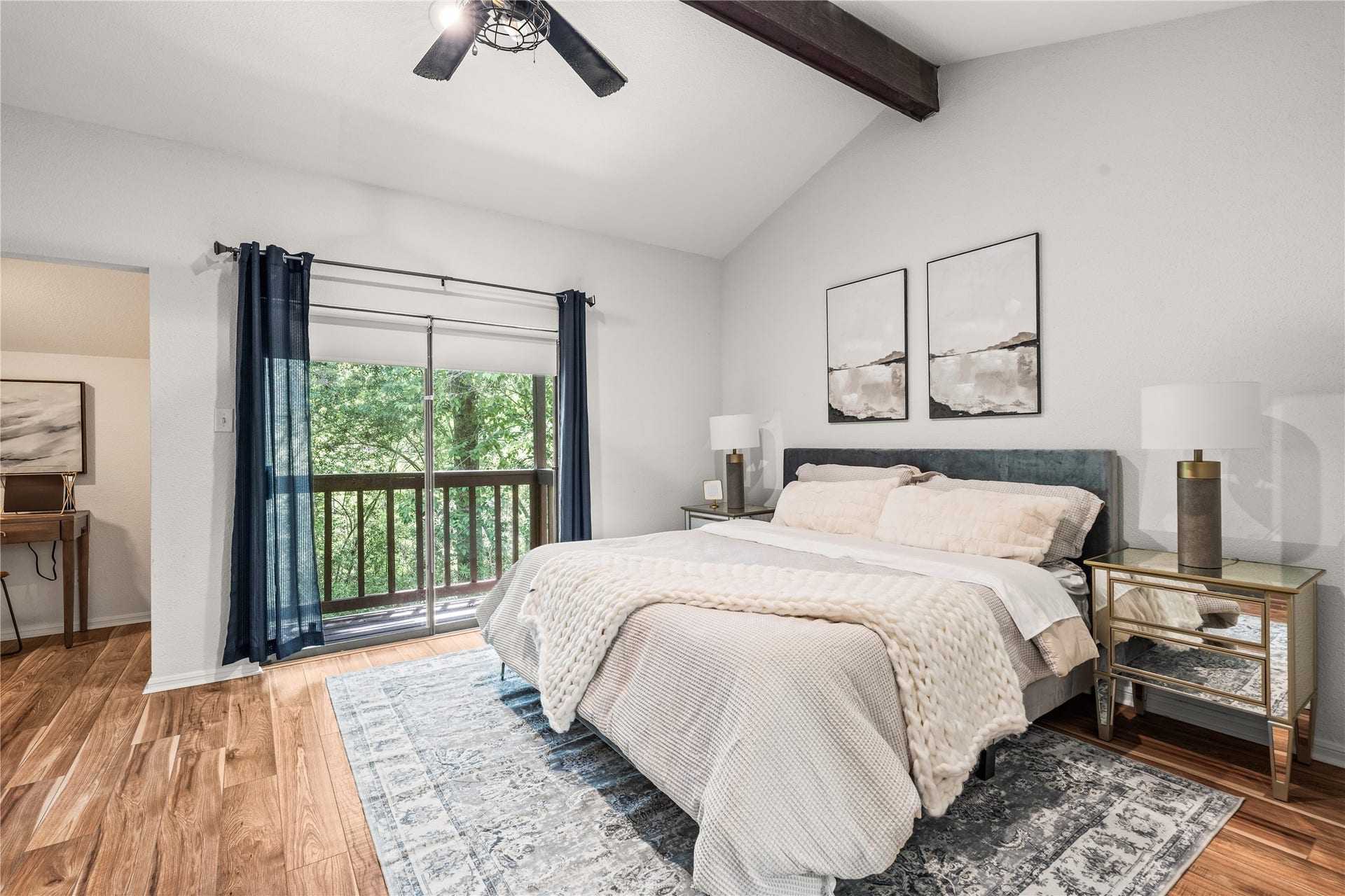 11711 Memorial Drive, #593, Houston, TX 77024 Wake up to peaceful treetop views from your private balcony, all within a spacious primary suite highlighted by vaulted ceilings and an exposed wood beam.