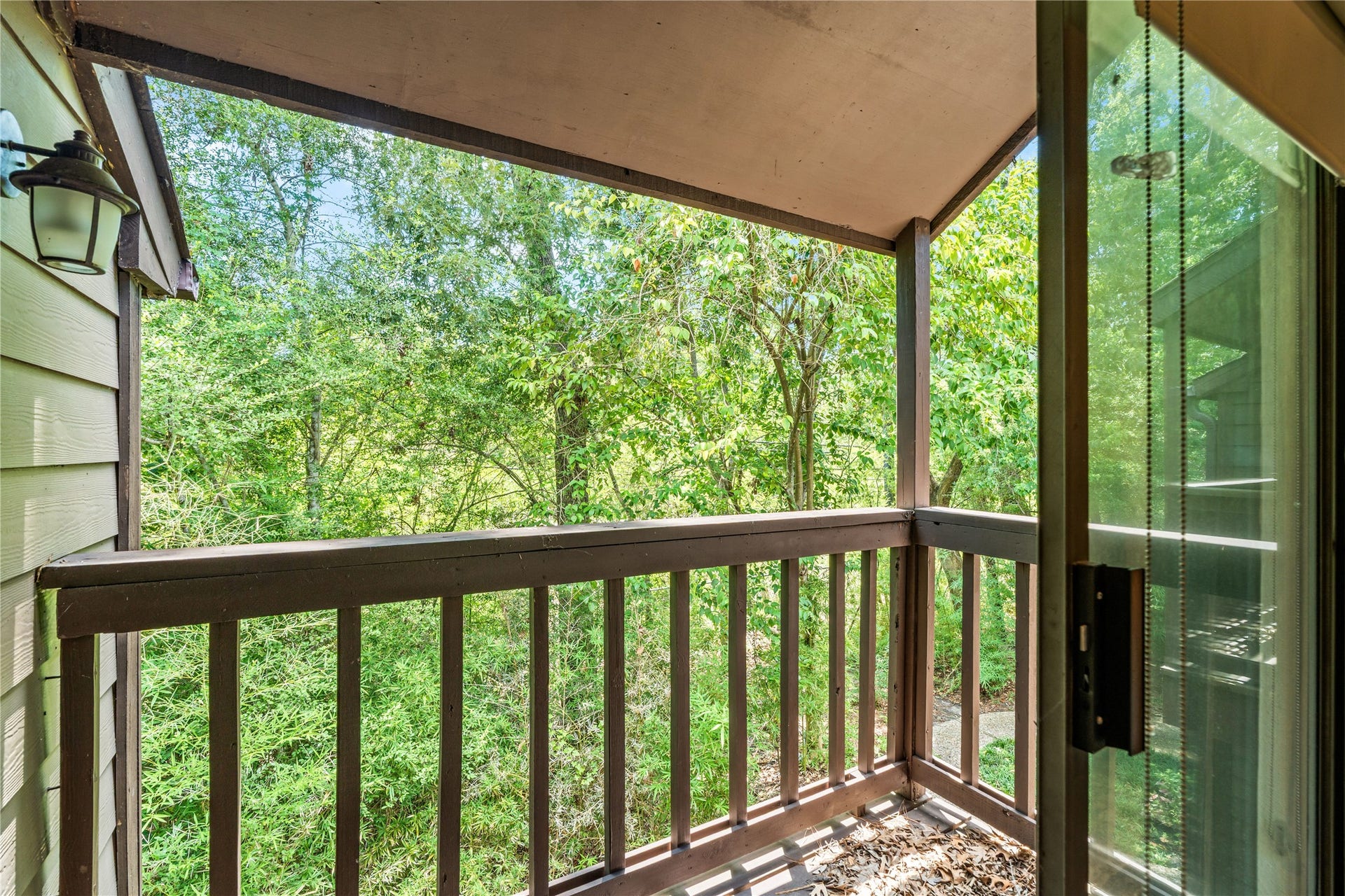 11711 Memorial Drive, #593, Houston, TX 77024 Step outside to your private covered balcony, where mature trees create a peaceful backdrop for your morning coffee or evening unwind.