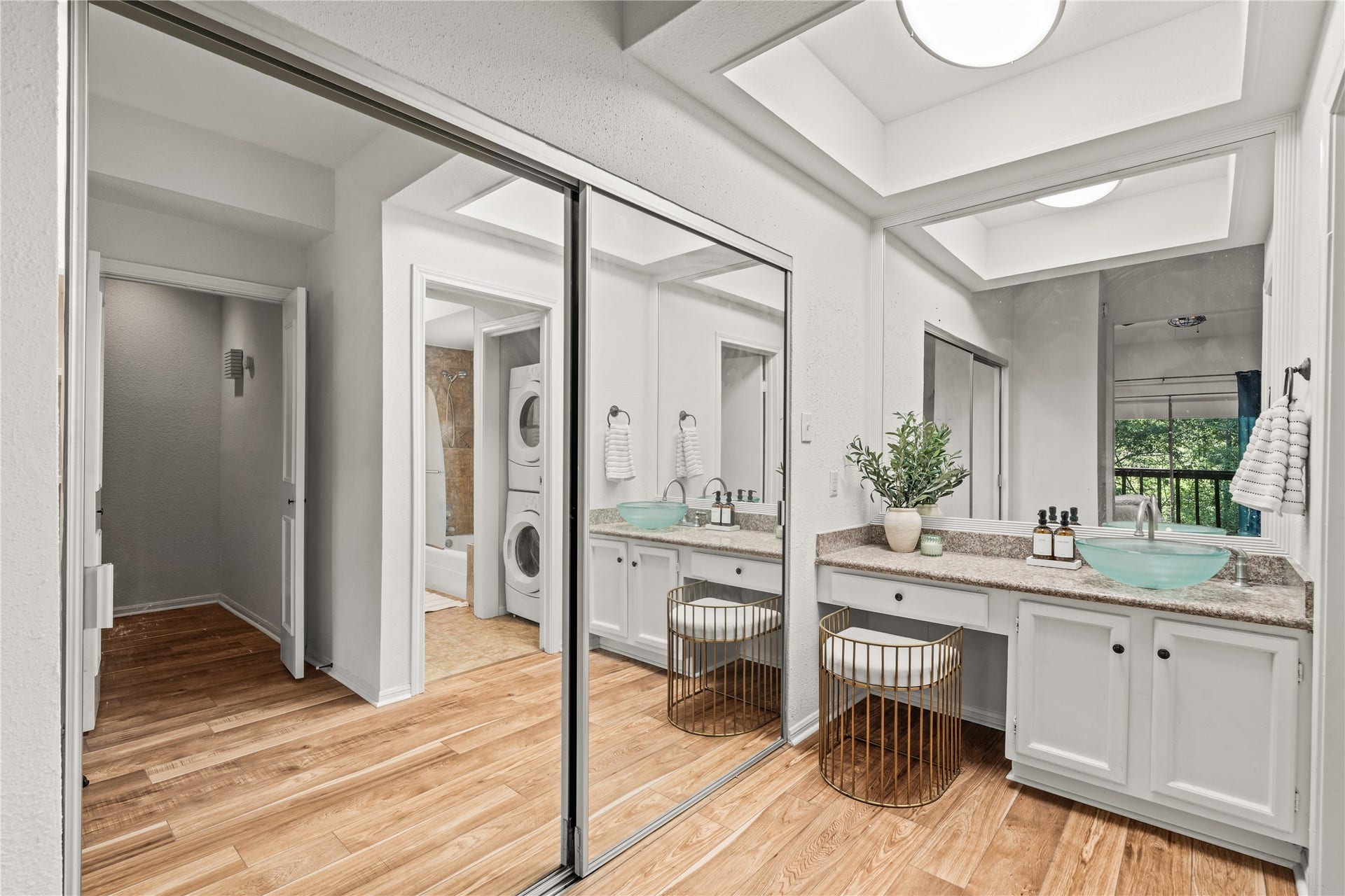 11711 Memorial Drive, #593, Houston, TX 77024 The primary suite pairs generous closet space with a dedicated vanity, making busy mornings feel a little more organized.