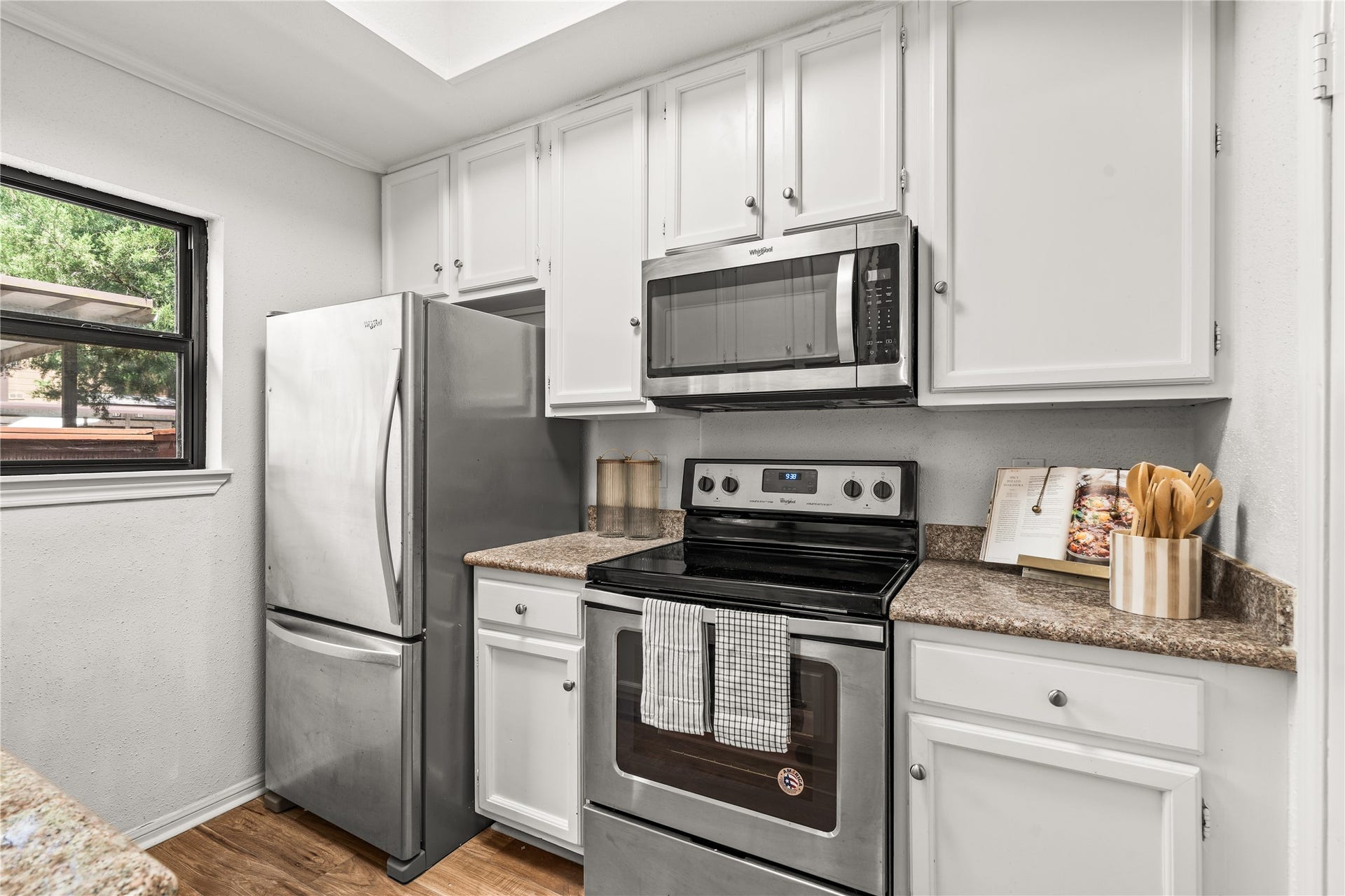 11711 Memorial Drive, #593, Houston, TX 77024 A practical layout, plentiful cabinetry, and stainless steel appliances make the kitchen as functional as it is inviting.