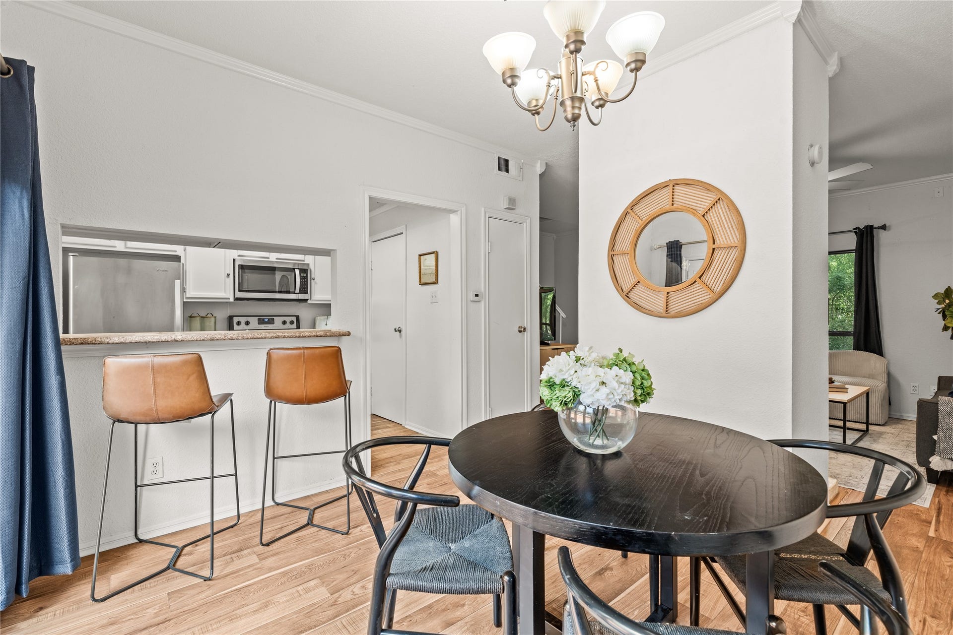 11711 Memorial Drive, #593, Houston, TX 77024 A pass-through breakfast bar keeps the kitchen connected to the dining area, making everyday meals and casual conversations feel effortless.