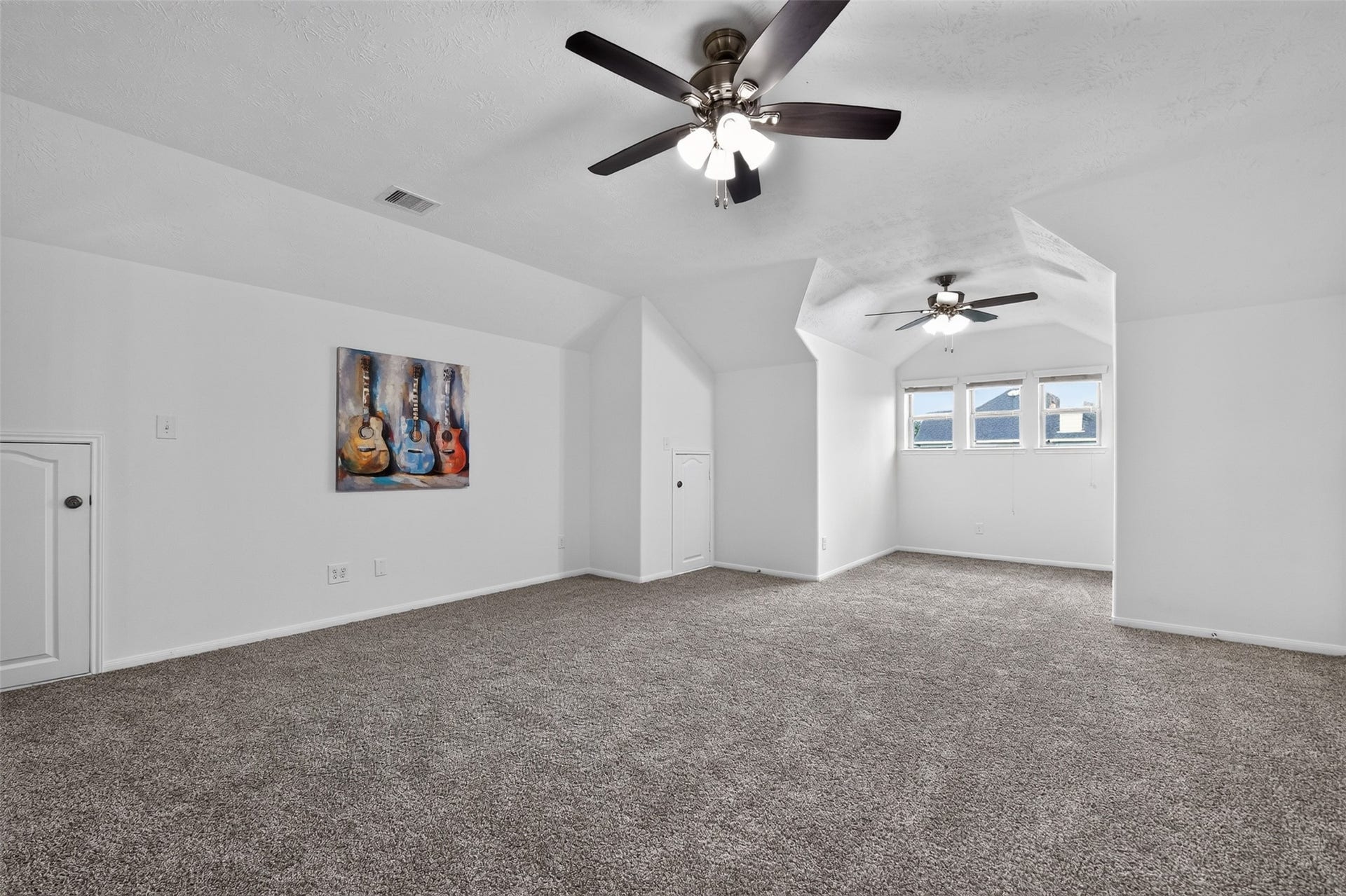 2203 Summit Pass Lane, League City, TX 77573 Family (or "game") room located upstairs with new carpet and ceiling fan.