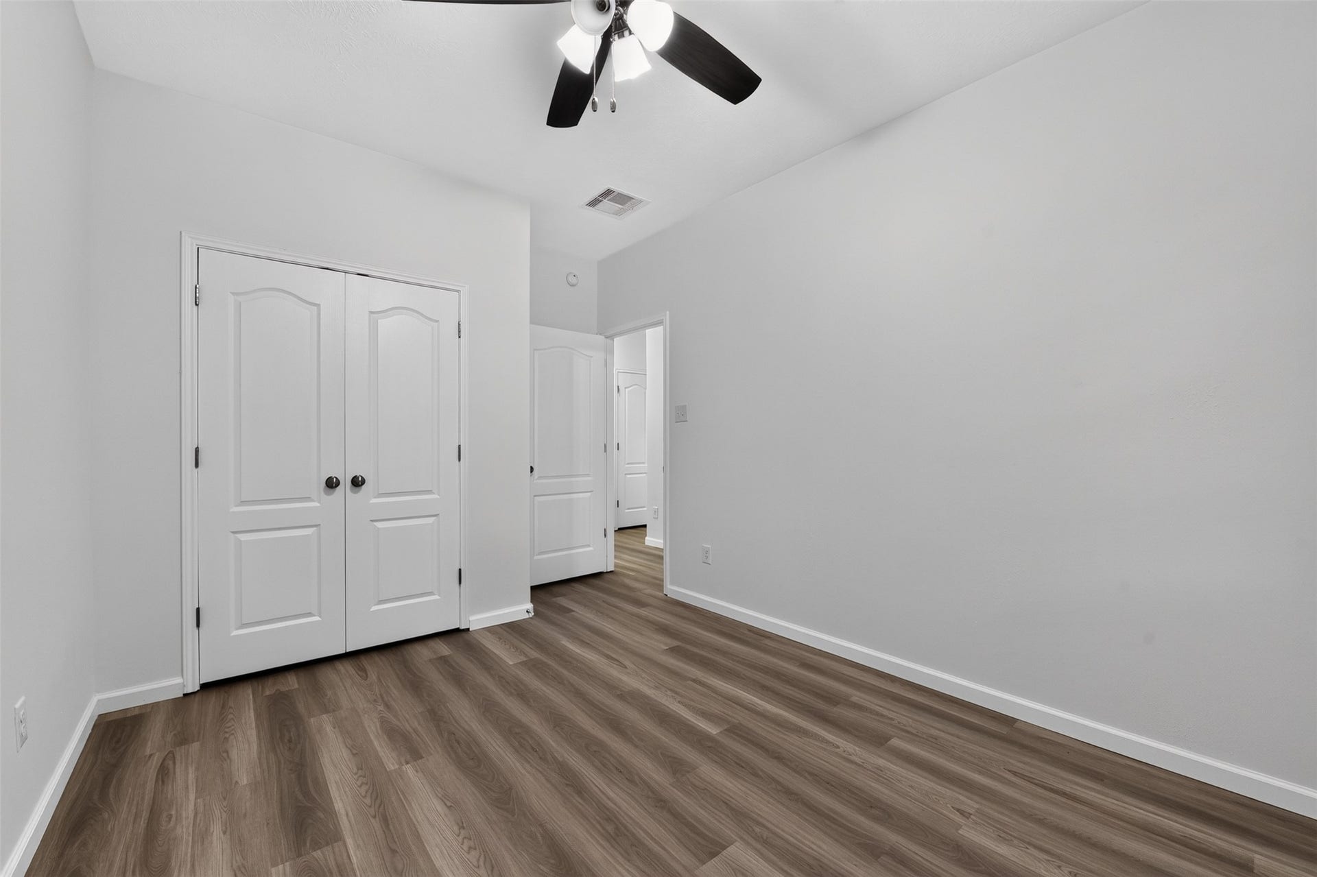 2203 Summit Pass Lane, League City, TX 77573 3rd Bedroom with new flooring and ceiling fan.