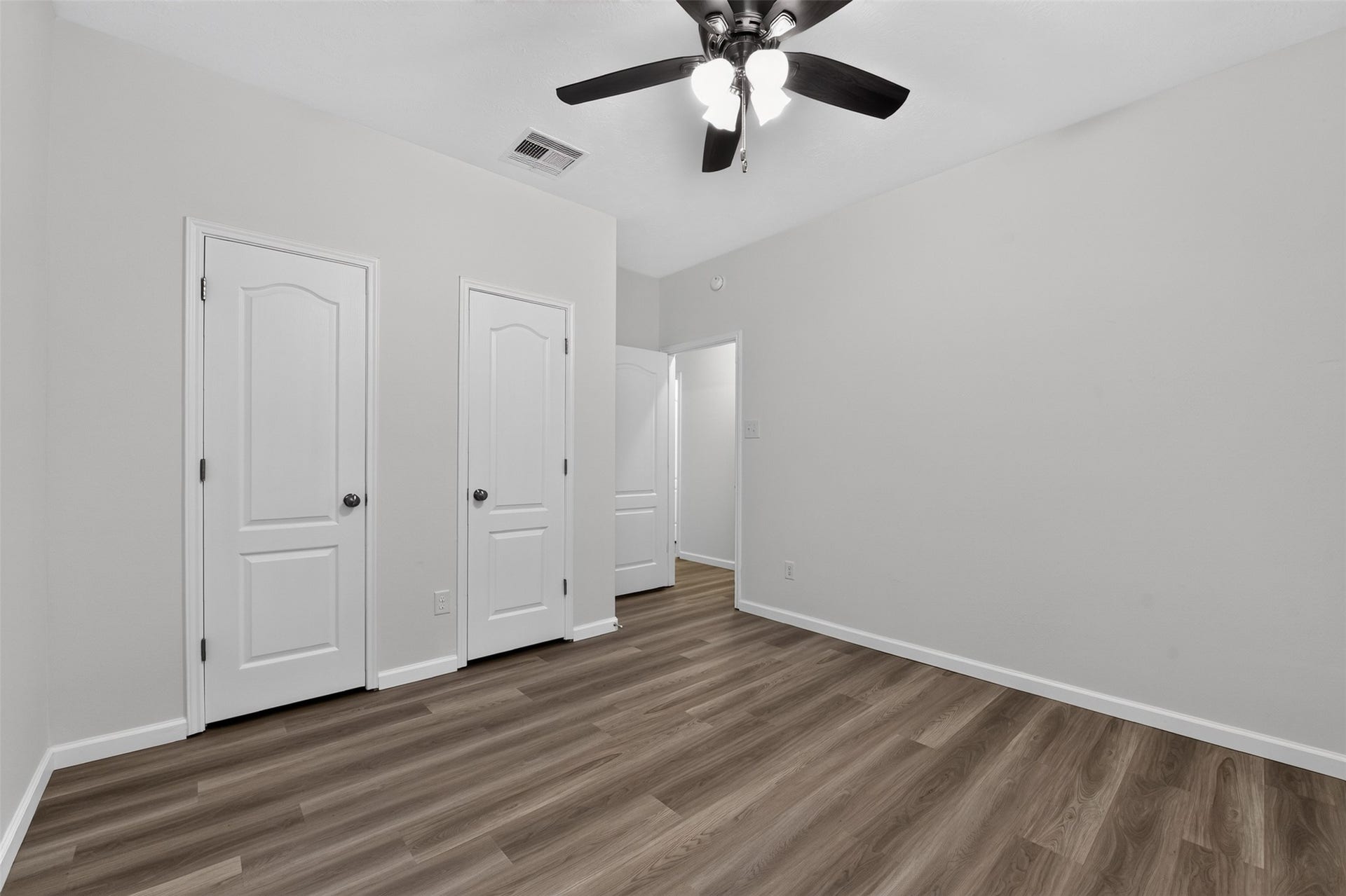 2203 Summit Pass Lane, League City, TX 77573 2nd Bedroom with new flooring and ceiling fan.