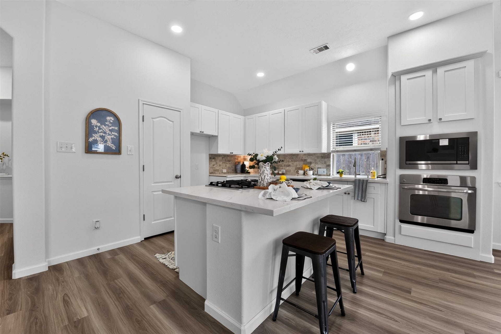 2203 Summit Pass Lane, League City, TX 77573 Kitchen with new Quartz countertops plus a large island with space for adding your own bar stools to create additional seating space.