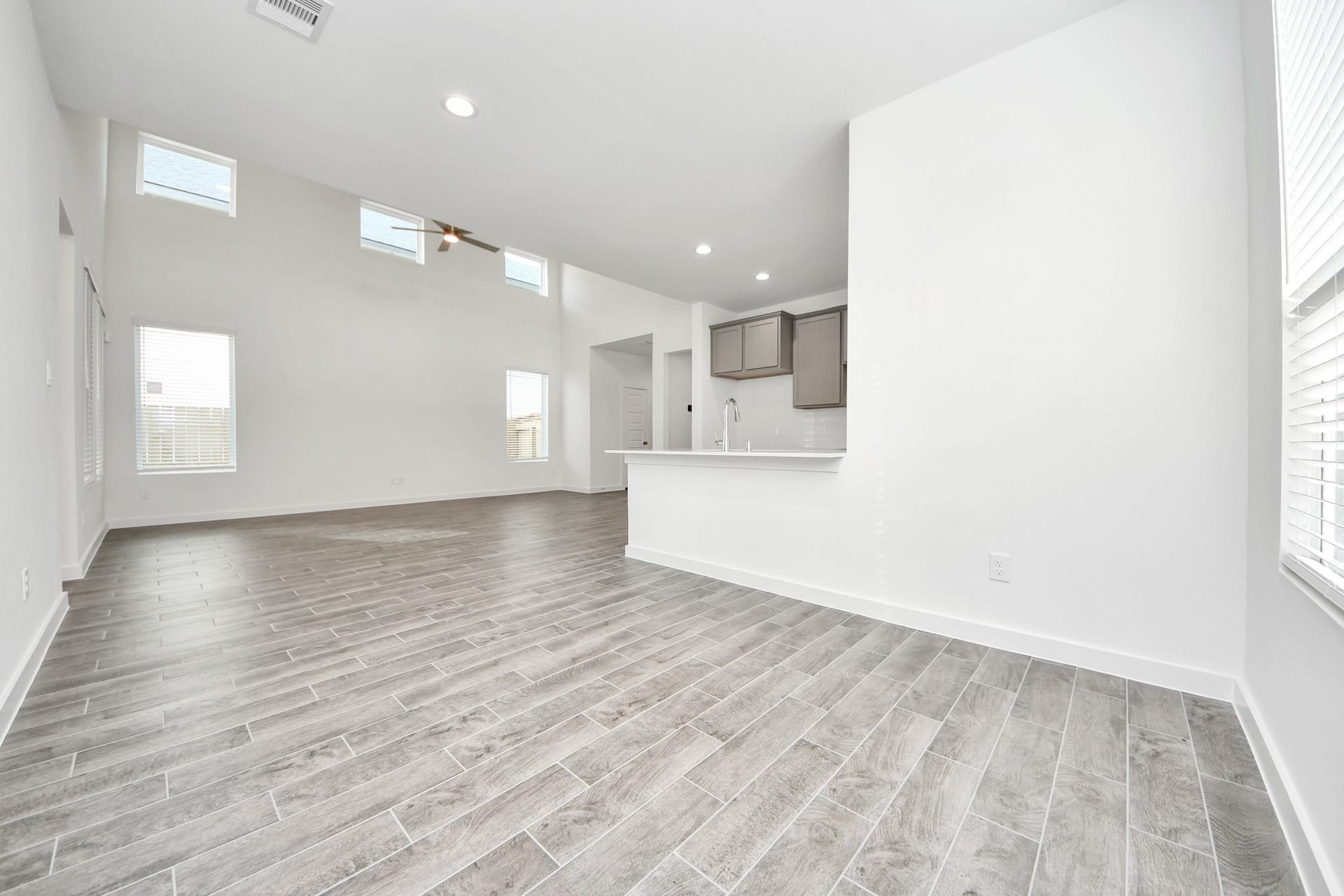 Enjoy breakfast with ease in the connected and cozy breakfast area, seamlessly integrated with the kitchen for utmost convenience. Step through the back door for a breath of fresh air onto the covered patio, extending your living space to the outdoors. v