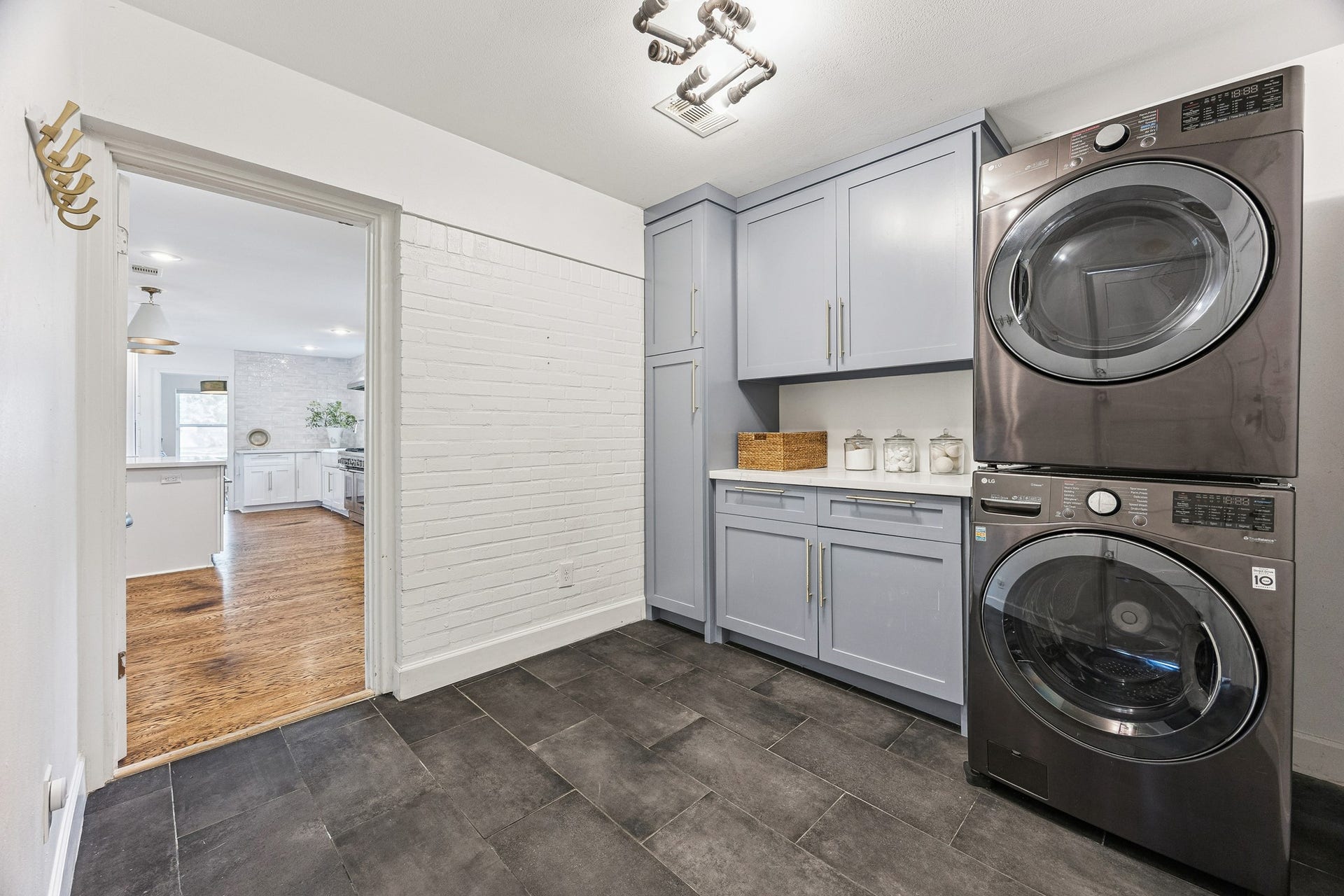 2503 Stoney Brook Drive, Houston, TX 77063 With custom cabinetry added in 2023, the laundry room boasts plenty of space and storage options readily available. Even this functional space reflects
the home's attention to detail. (Washer and Dryer excluded).